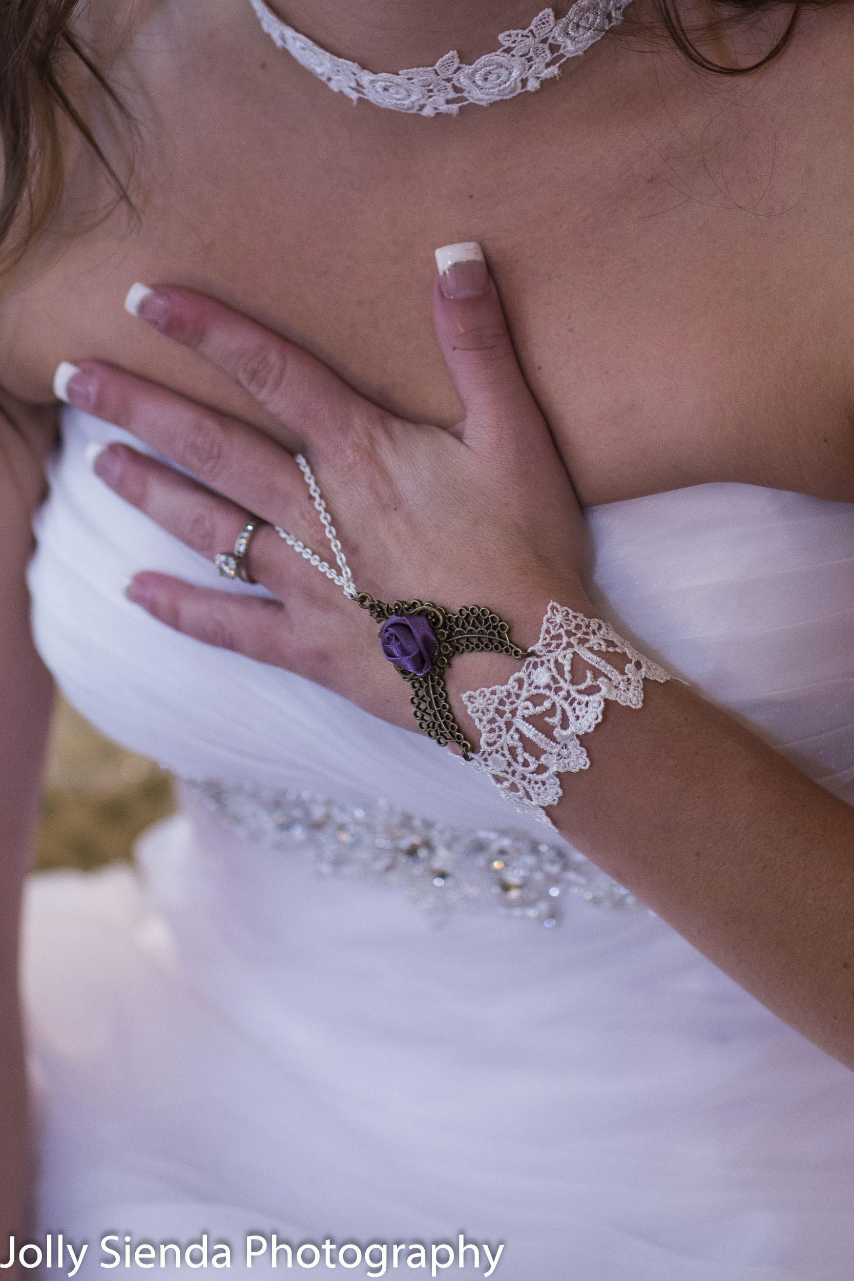 Wedding photogaphy with the brides wedding ring and lace