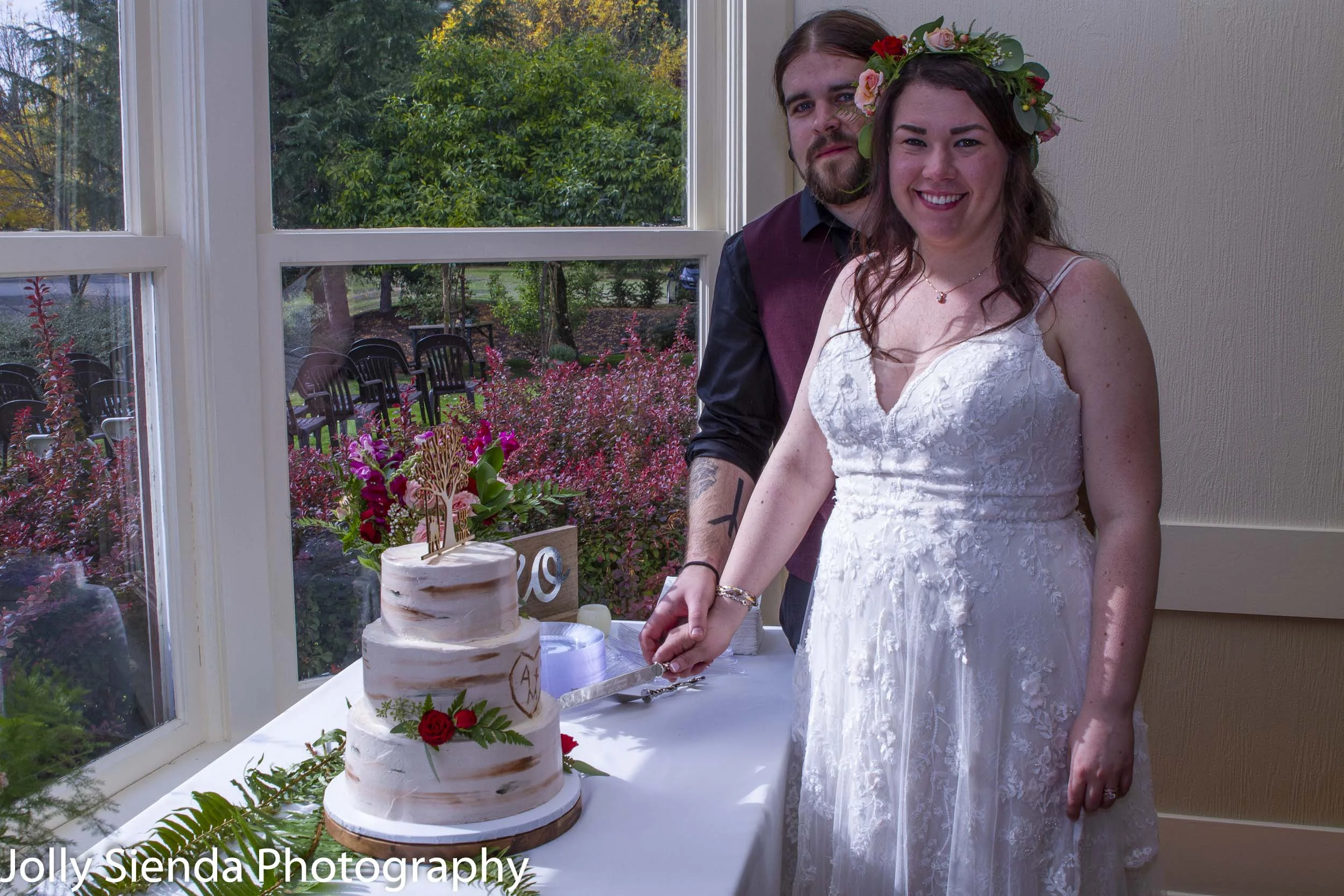 Amanda Marie and Matt Godsey cut their wedding cake