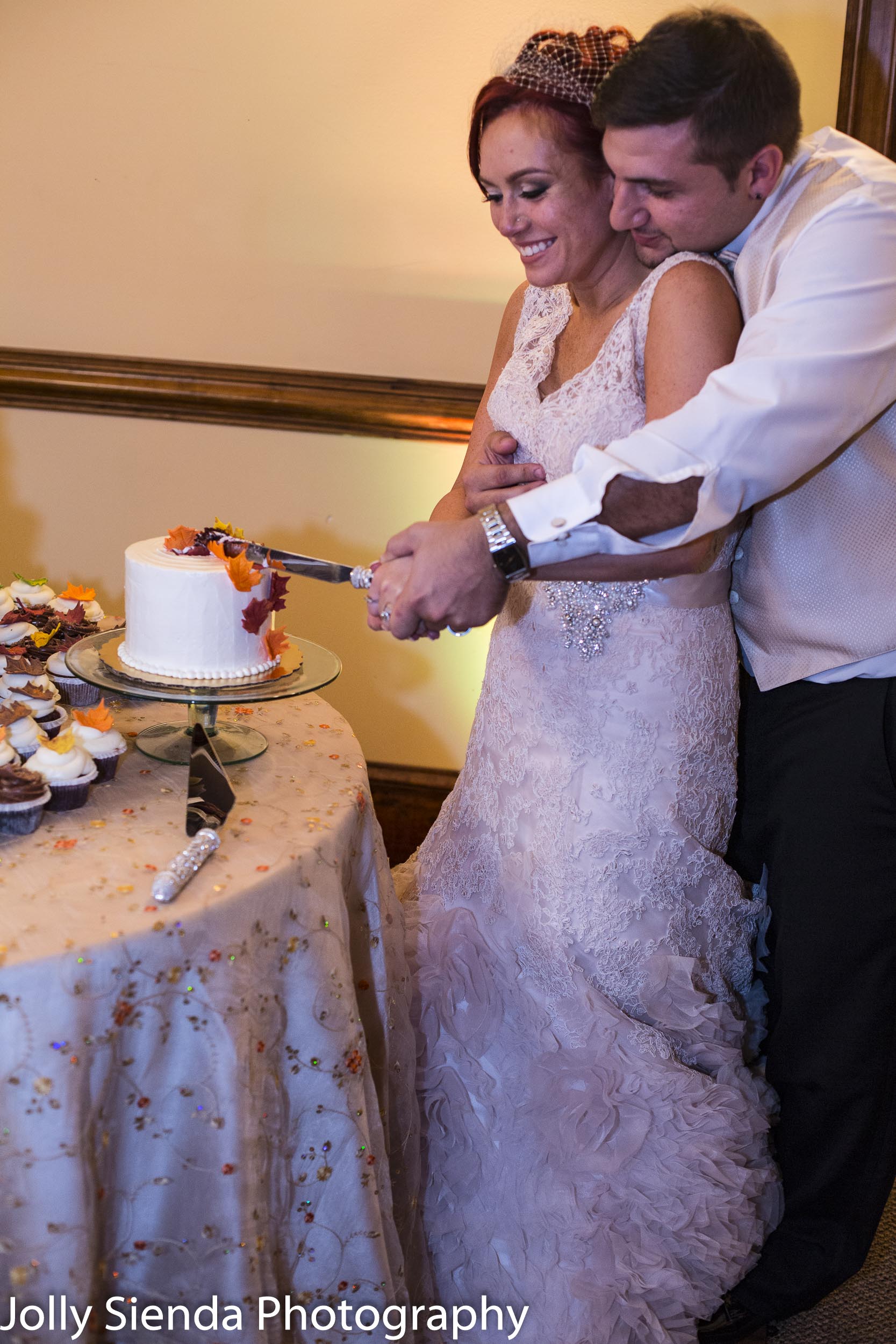 Cutting the autumn wedding cake