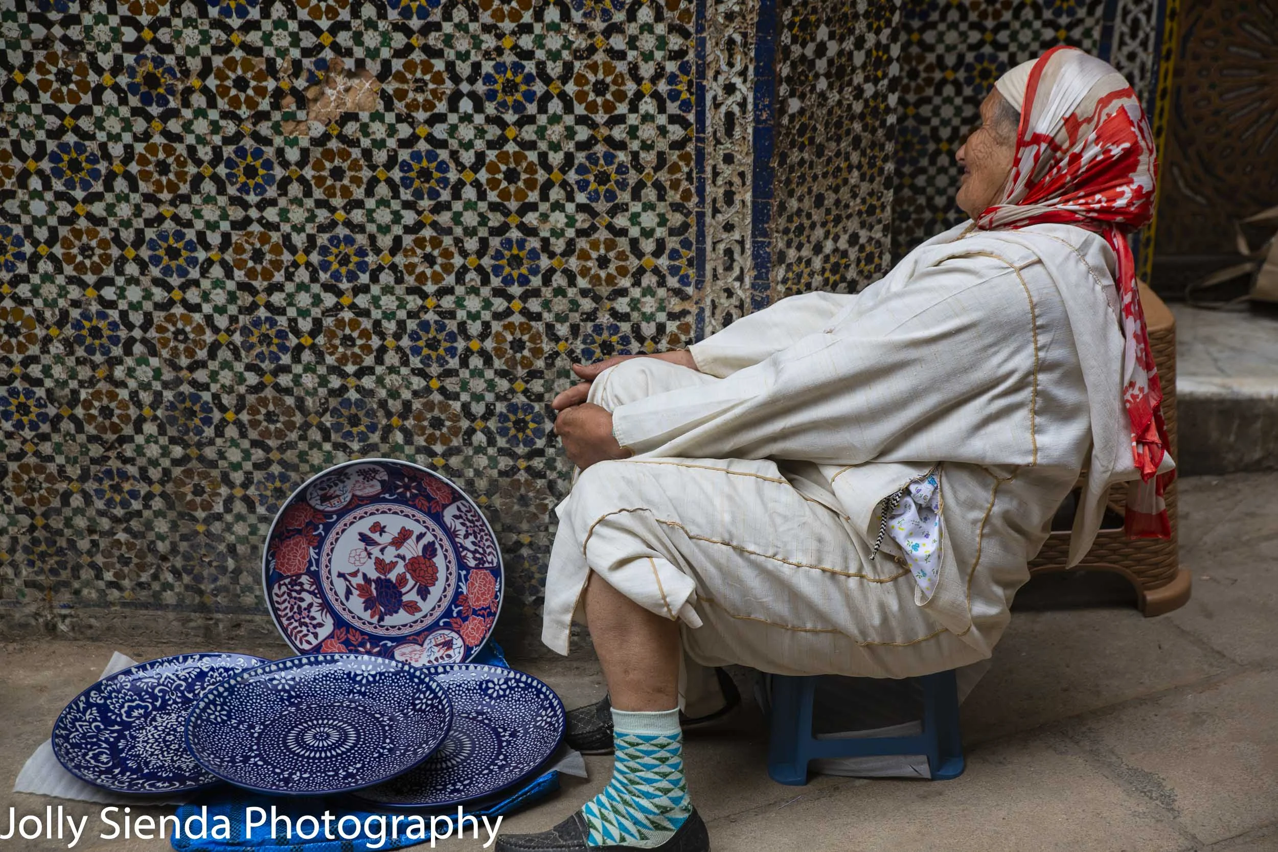 Woman selling Moroccan plates