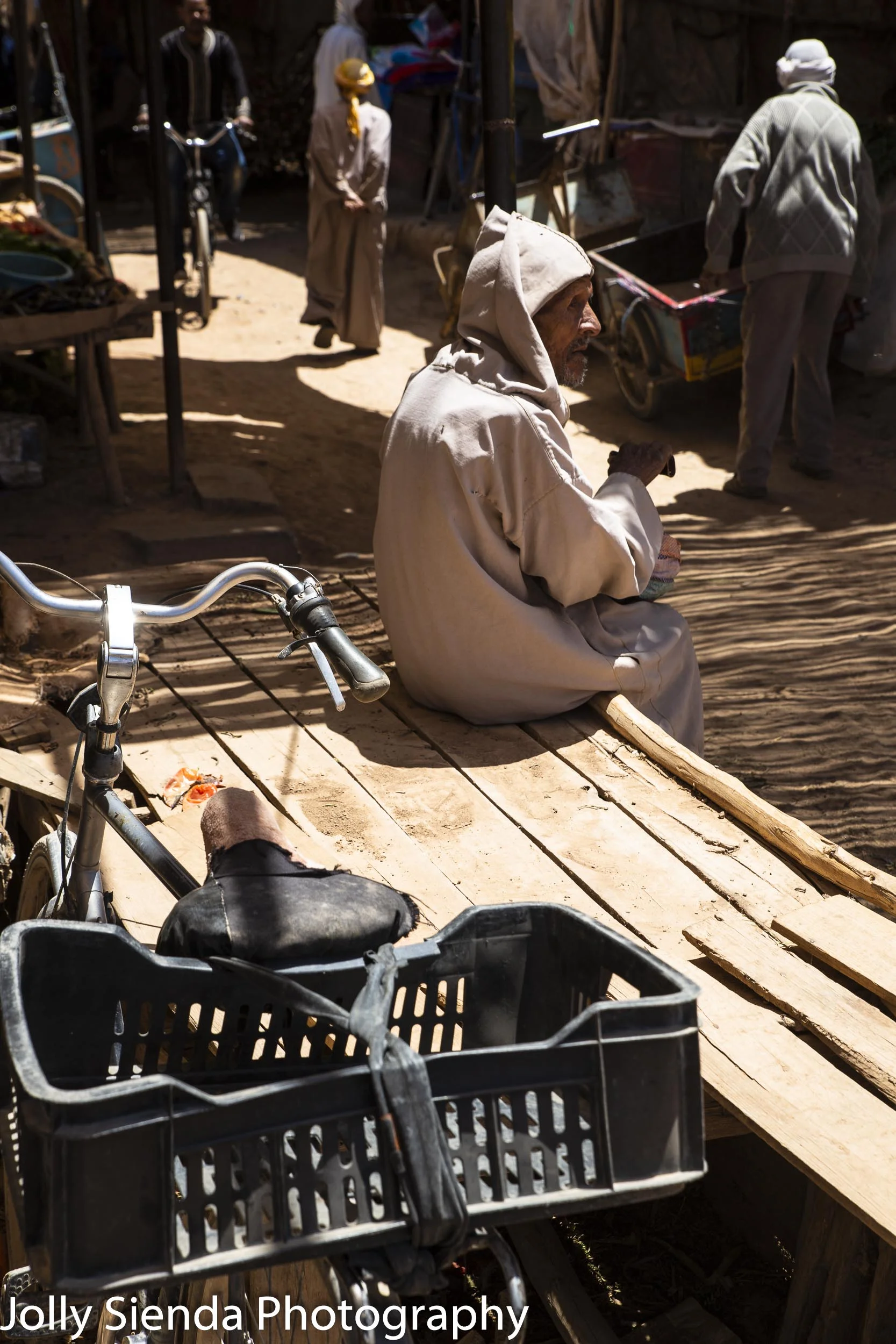 Moroccan people in a souk and bikes
