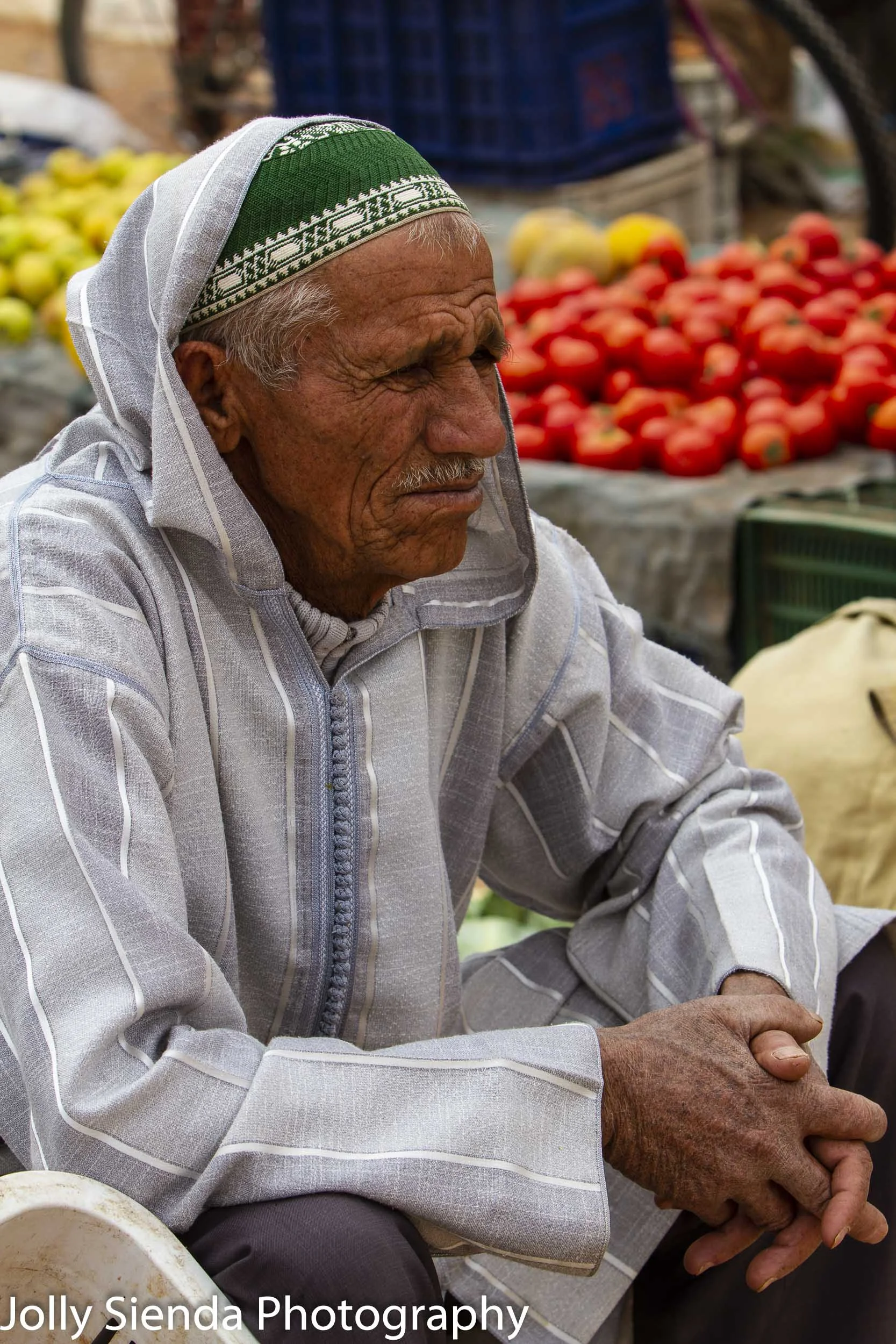 Man ponders at the outdoor market