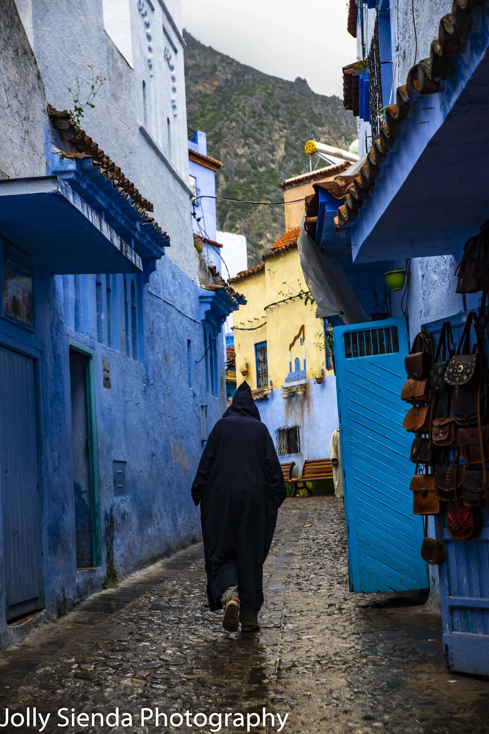 Moroccan man wears djellaba in blue Chefchaouen