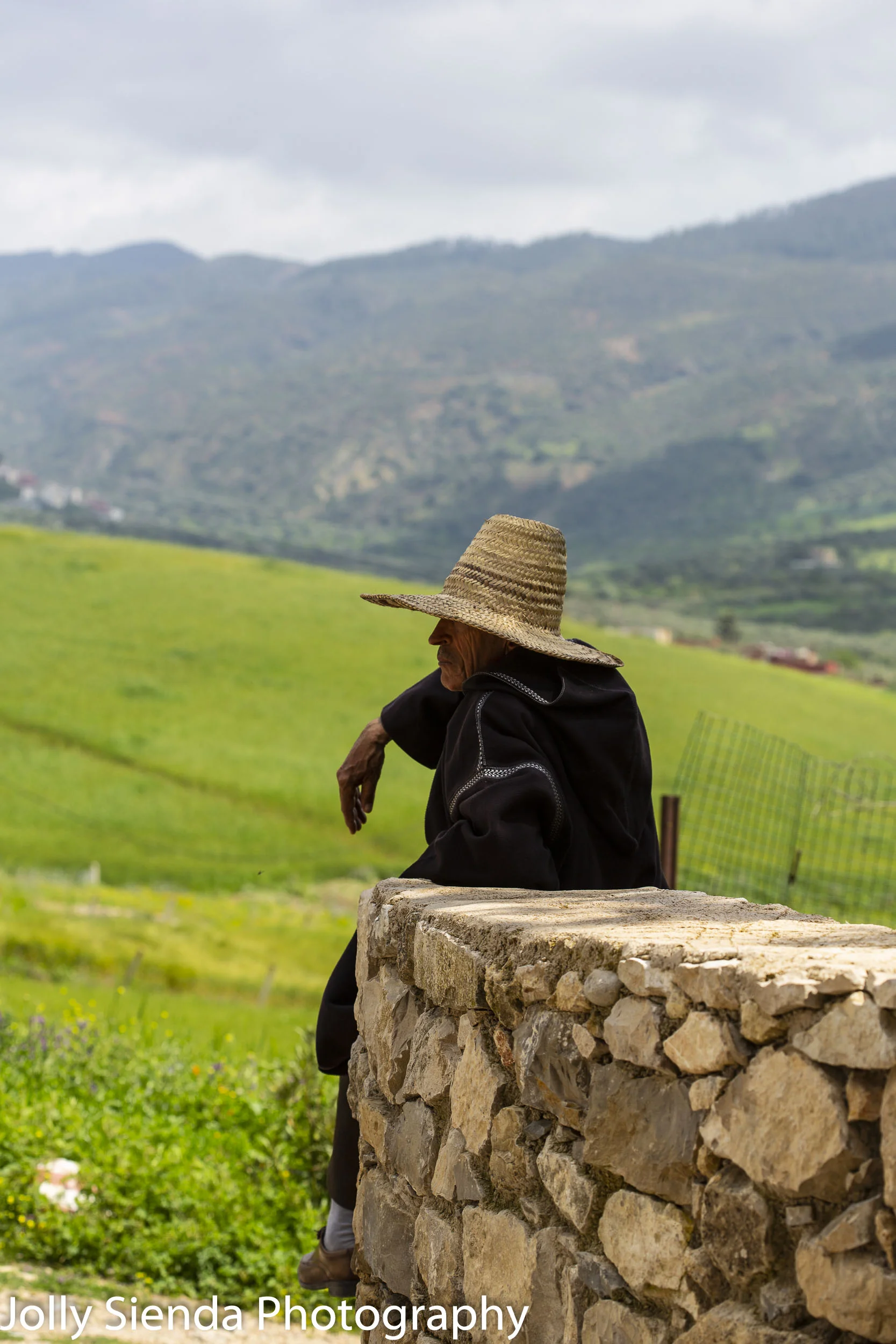 Shepherd wears a straw hat and rests