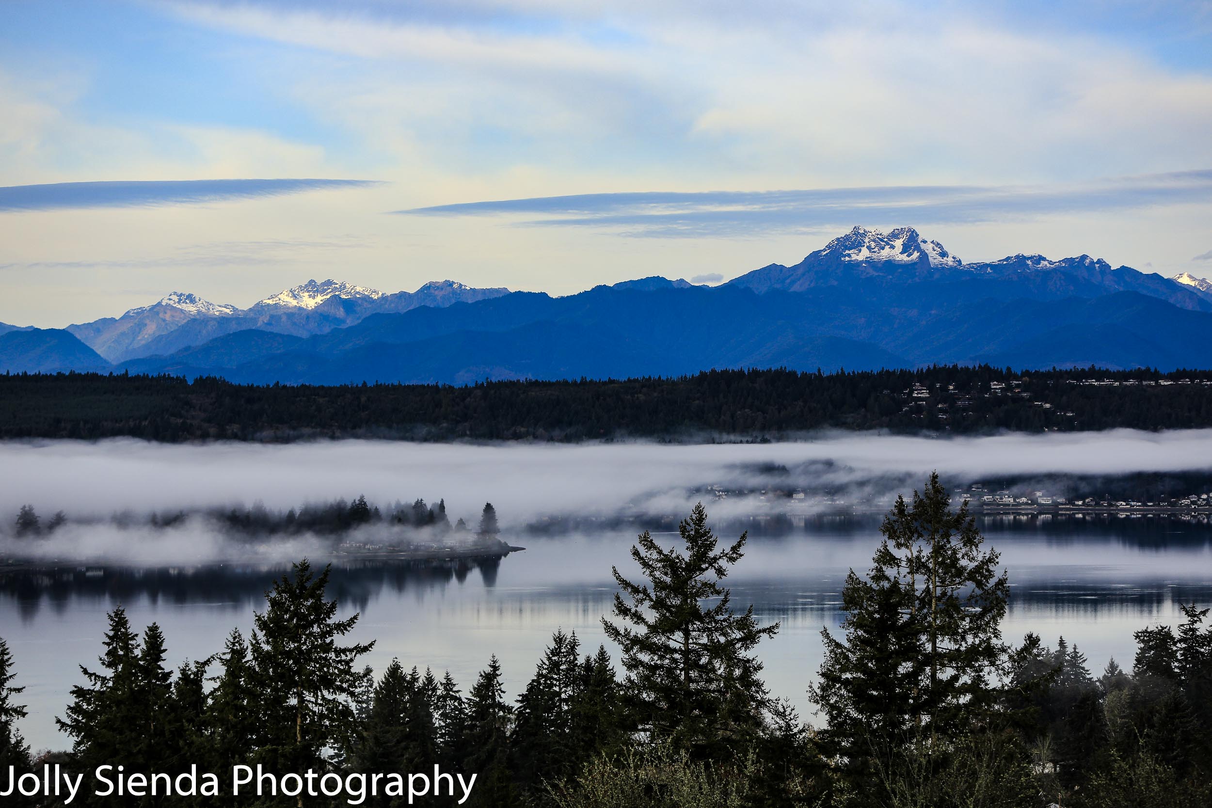 Autumn fog over Dyes Inlet and the Olympic Mountains