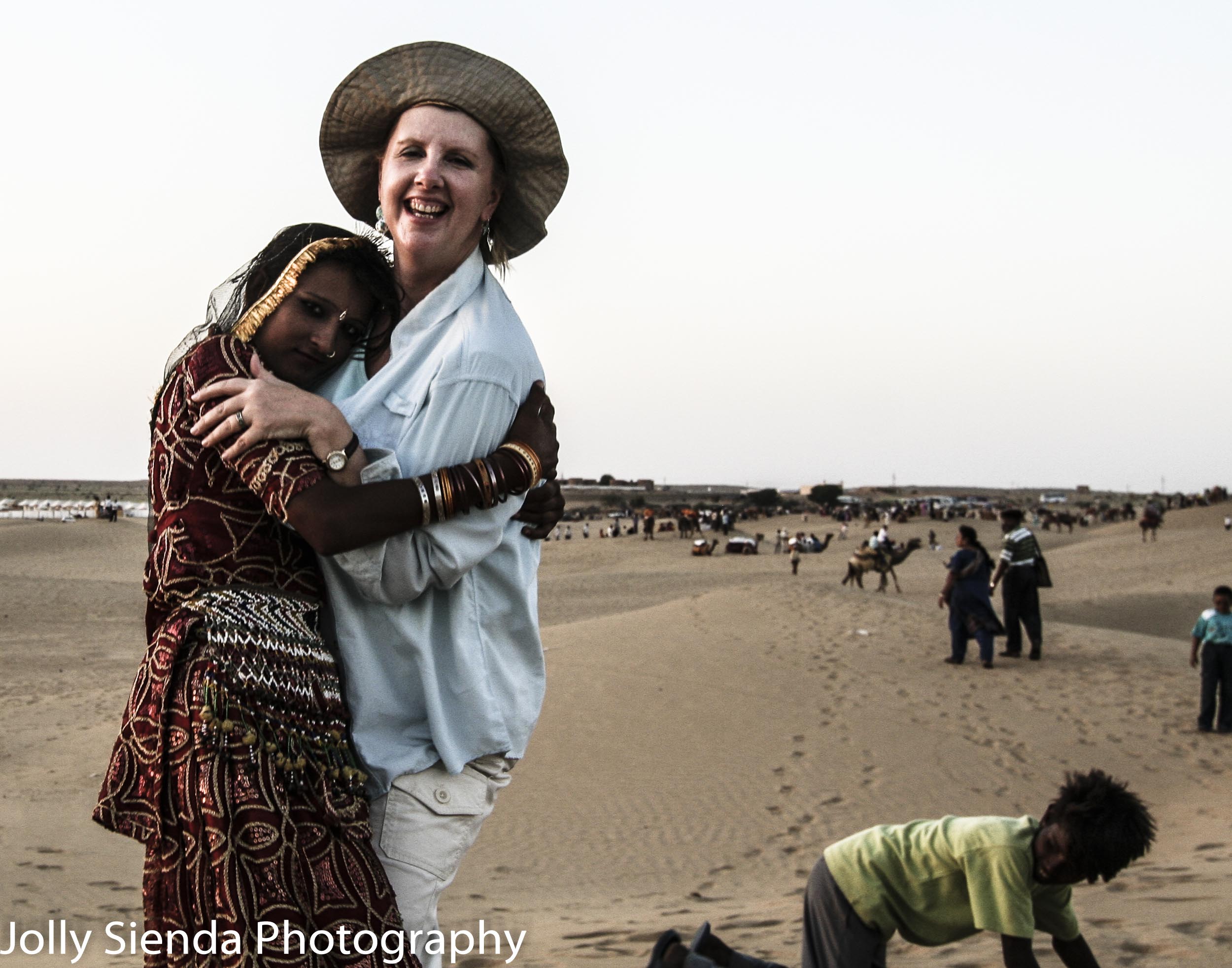 Jolly Sienda gets a hug from a Thar Desert dancer