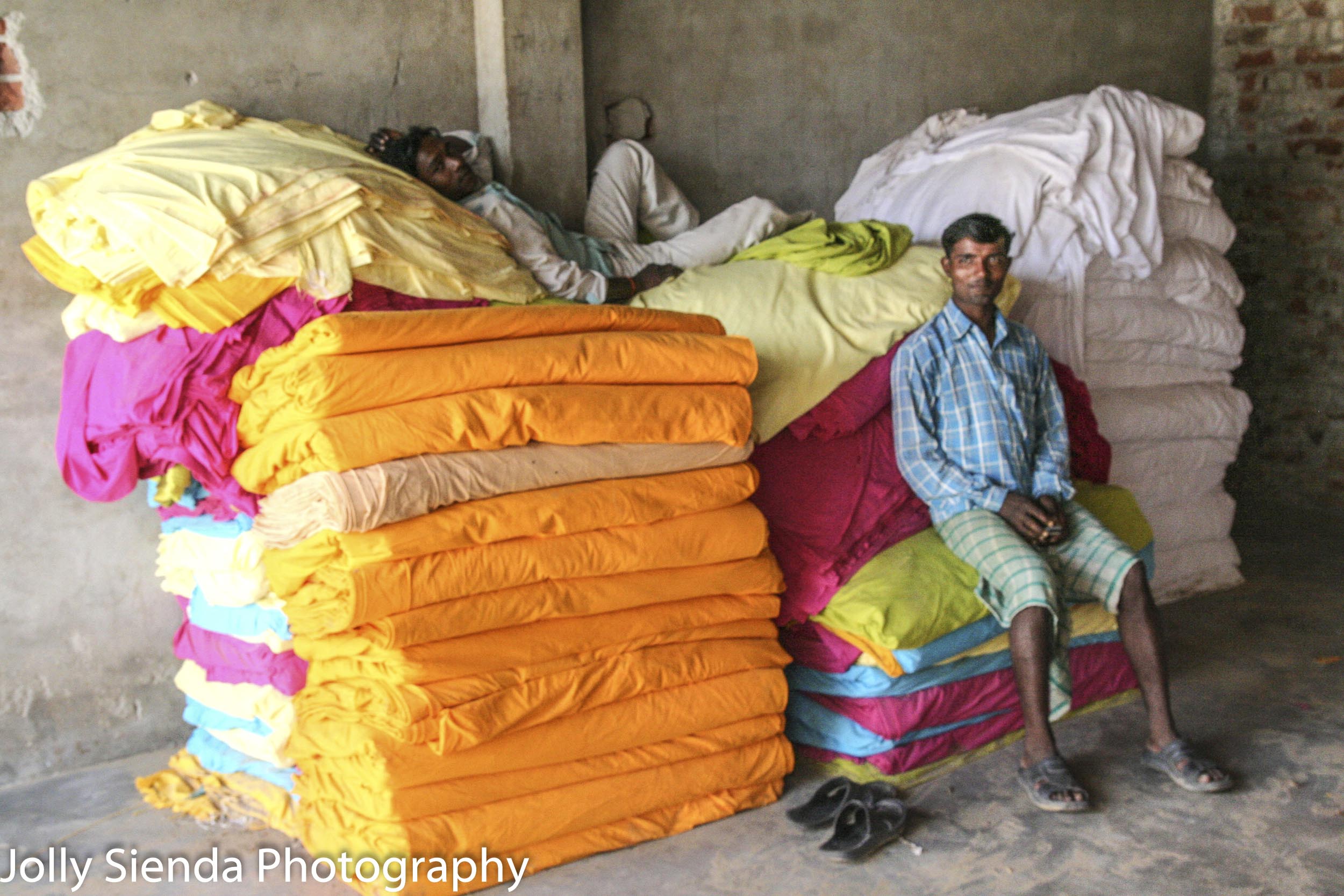 Print block factory workers rest on material