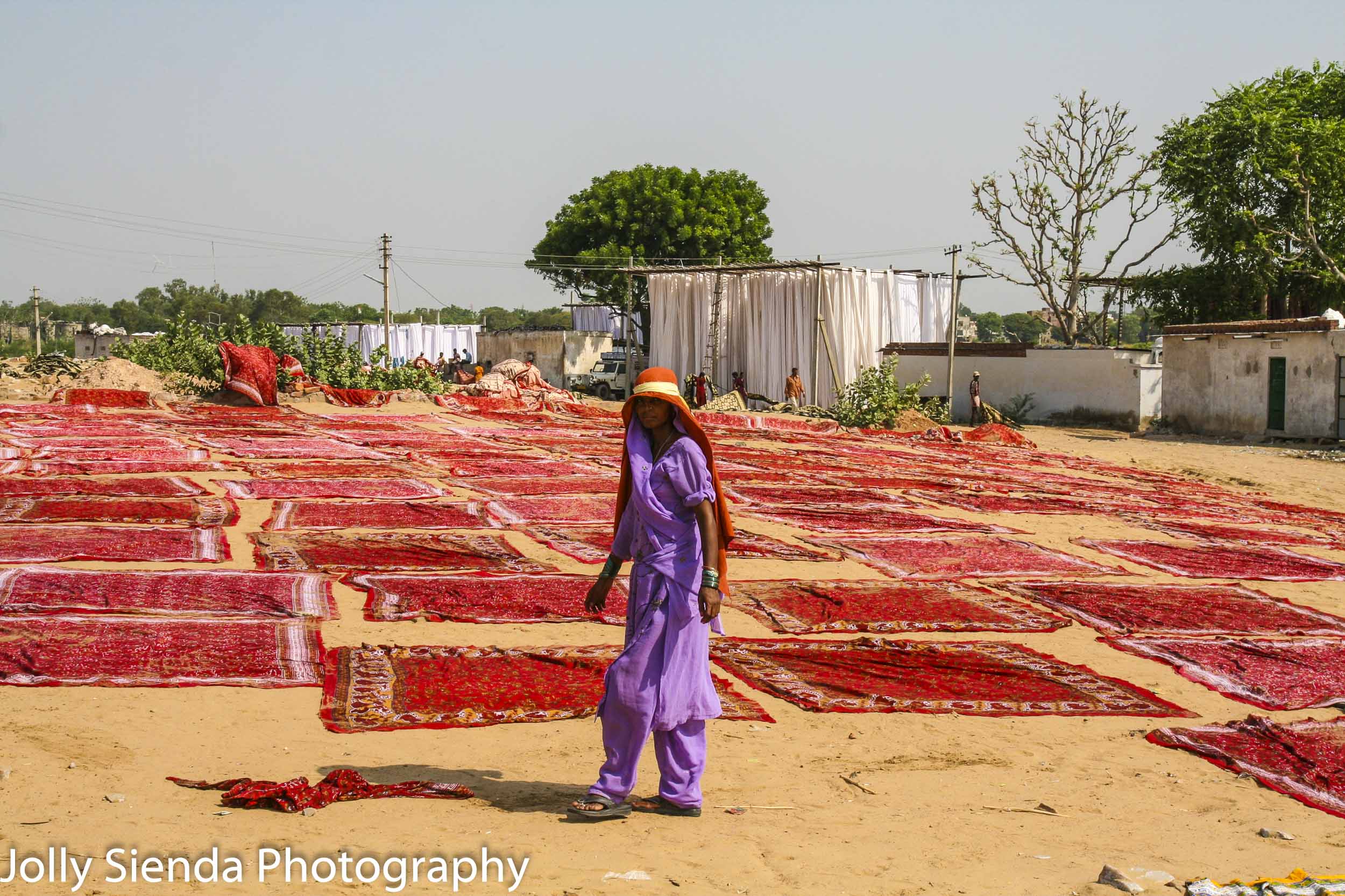 Block prints dry outside and a print block worker