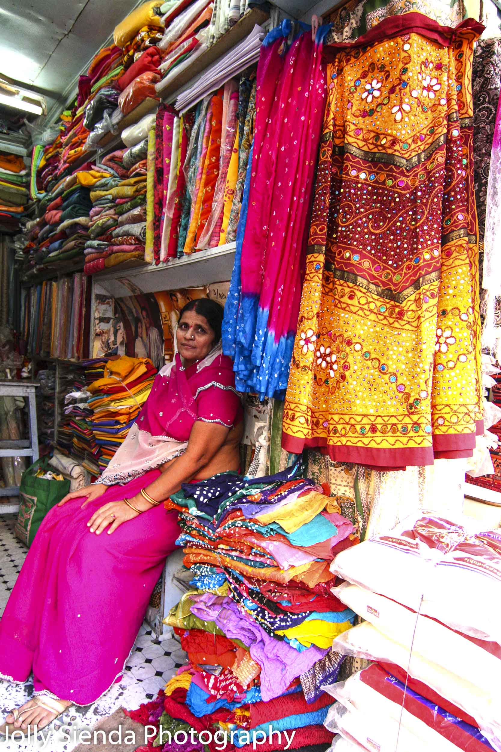 Woman selling saris