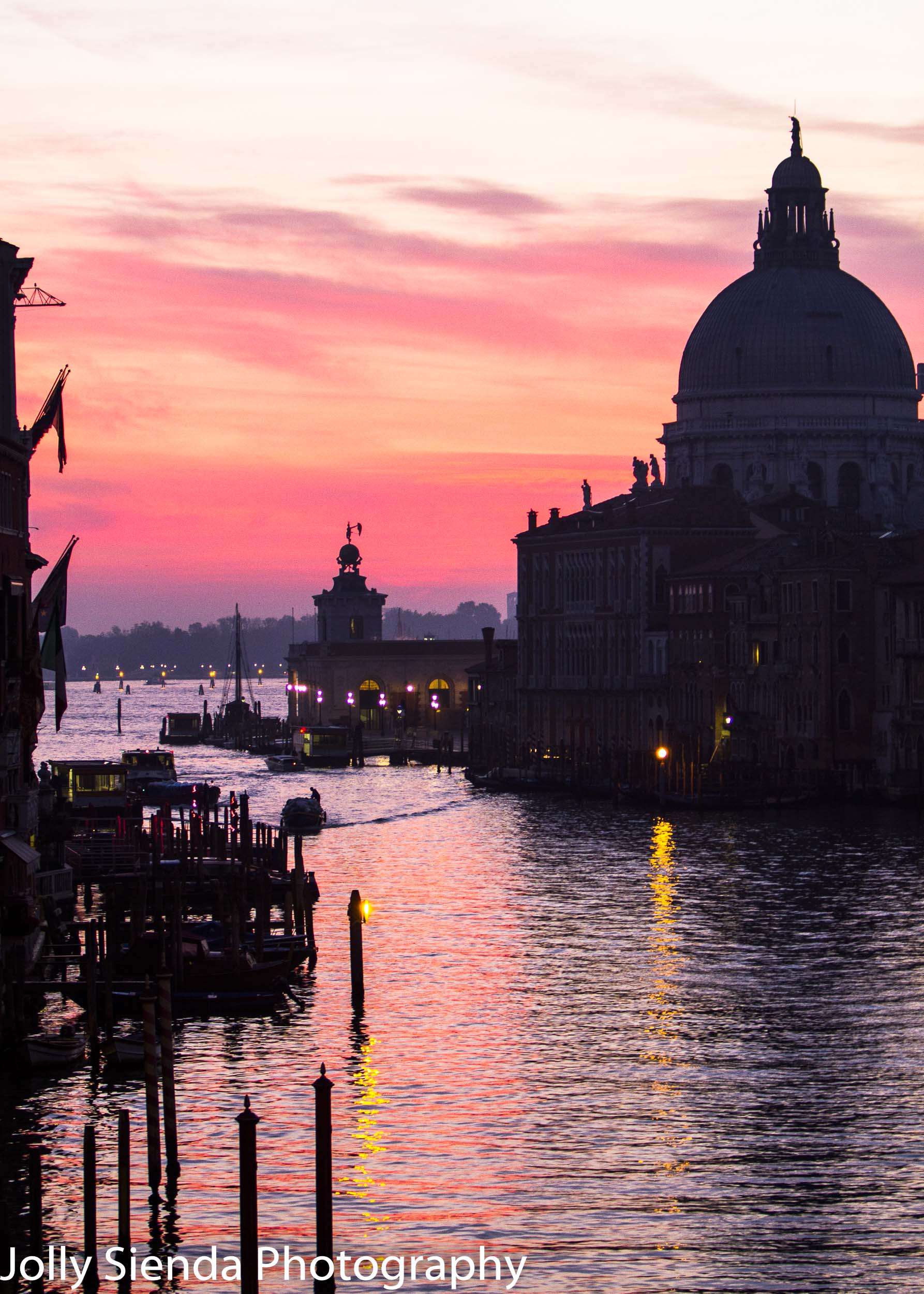 Pink and yellow sunrise over Santa Maria della salute and the Gr