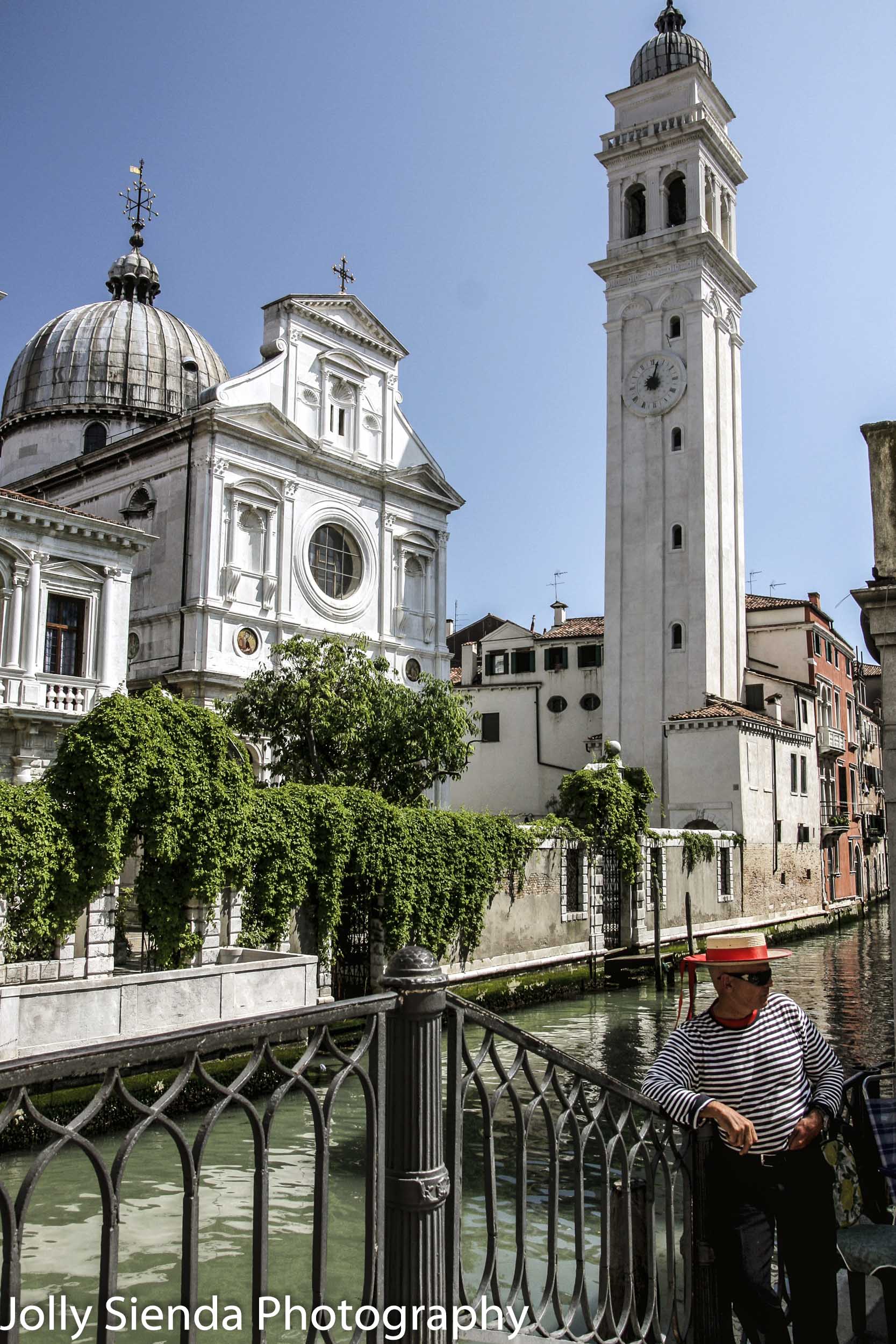 Leaning Venetian Church, a Canal, and a  Gondalier