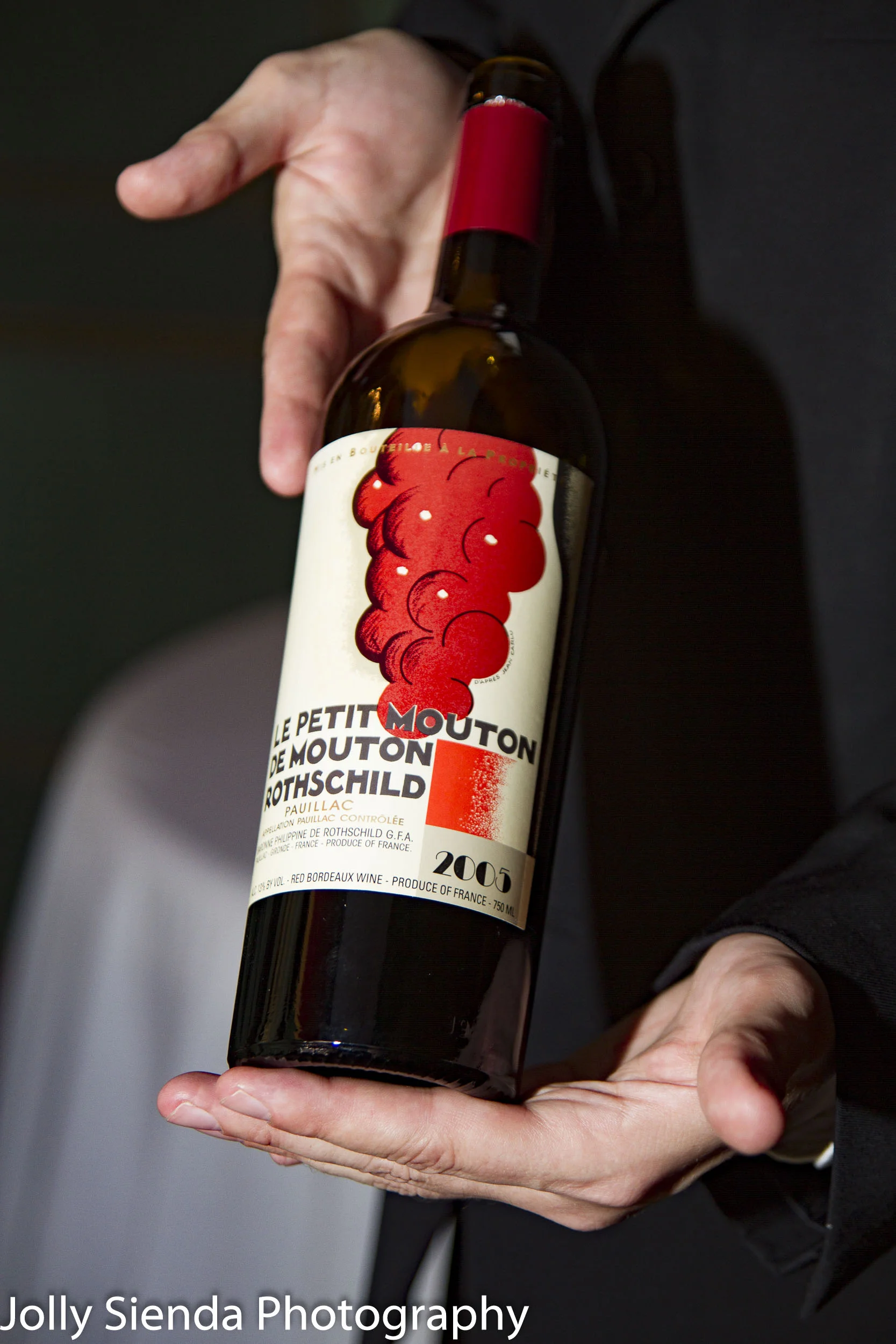 Showing off the wine, French Ambassadors Dinner