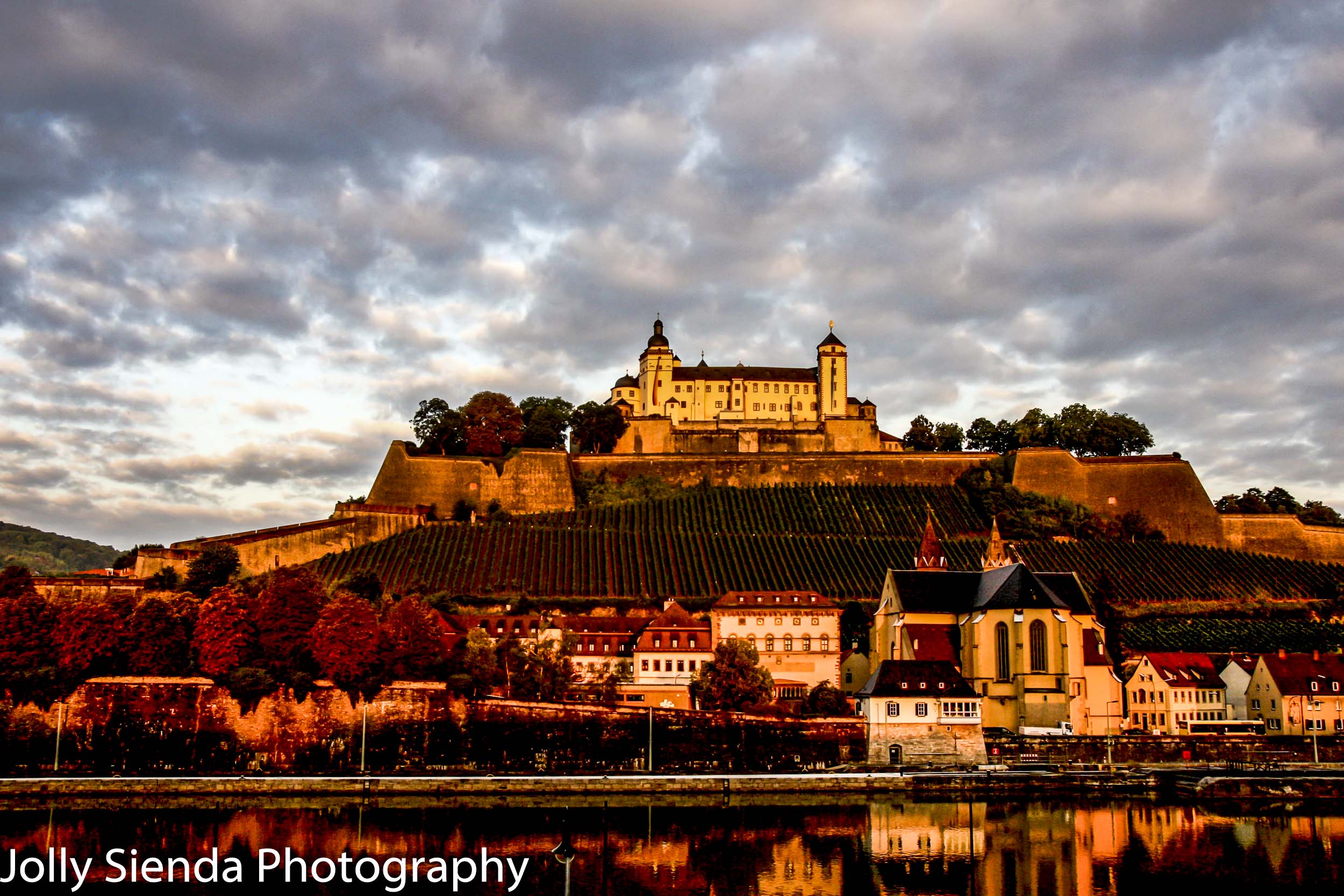 Fortress Marienburg basks in the sunset of Autumn colors with ne
