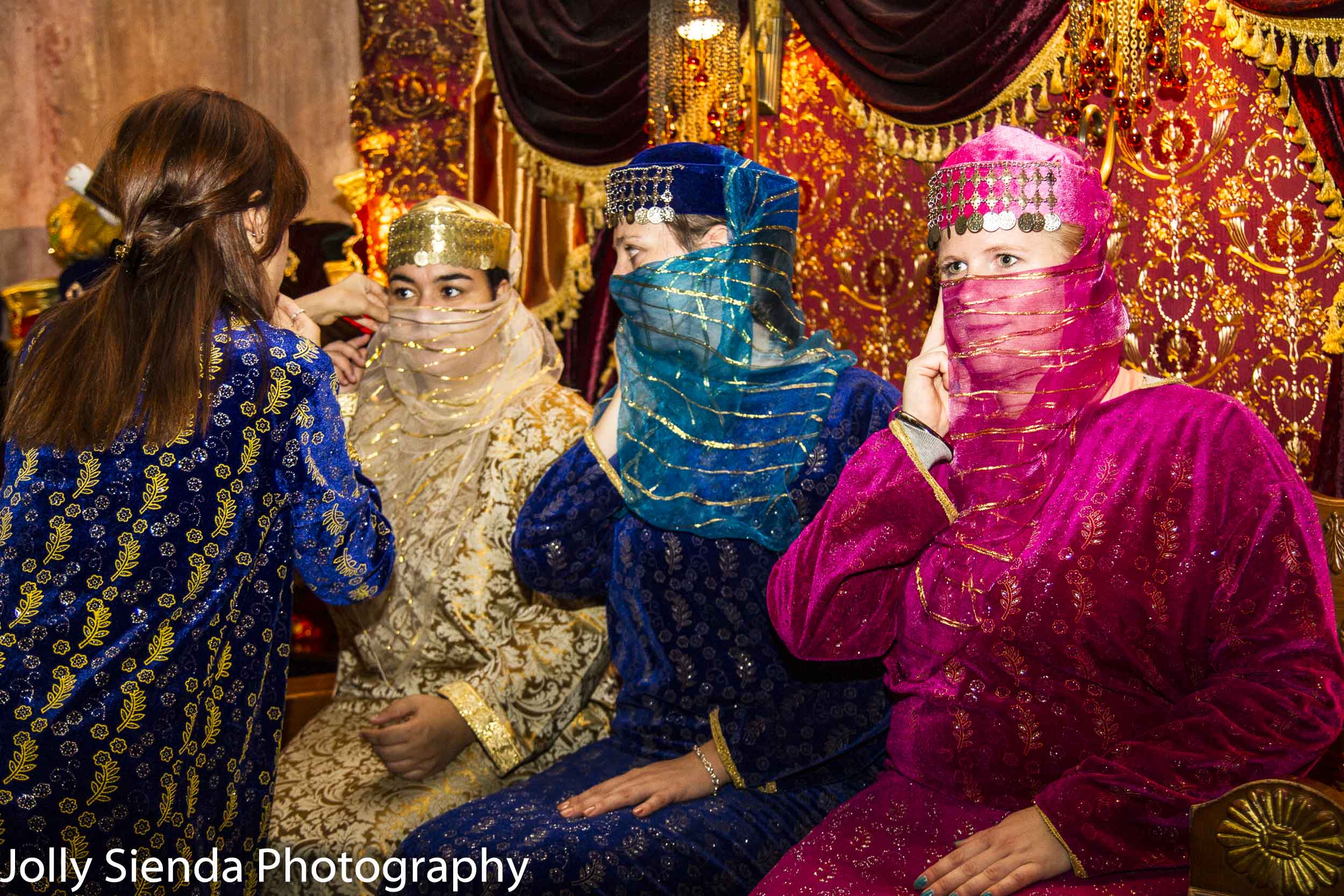 Women wearing colorful abayas