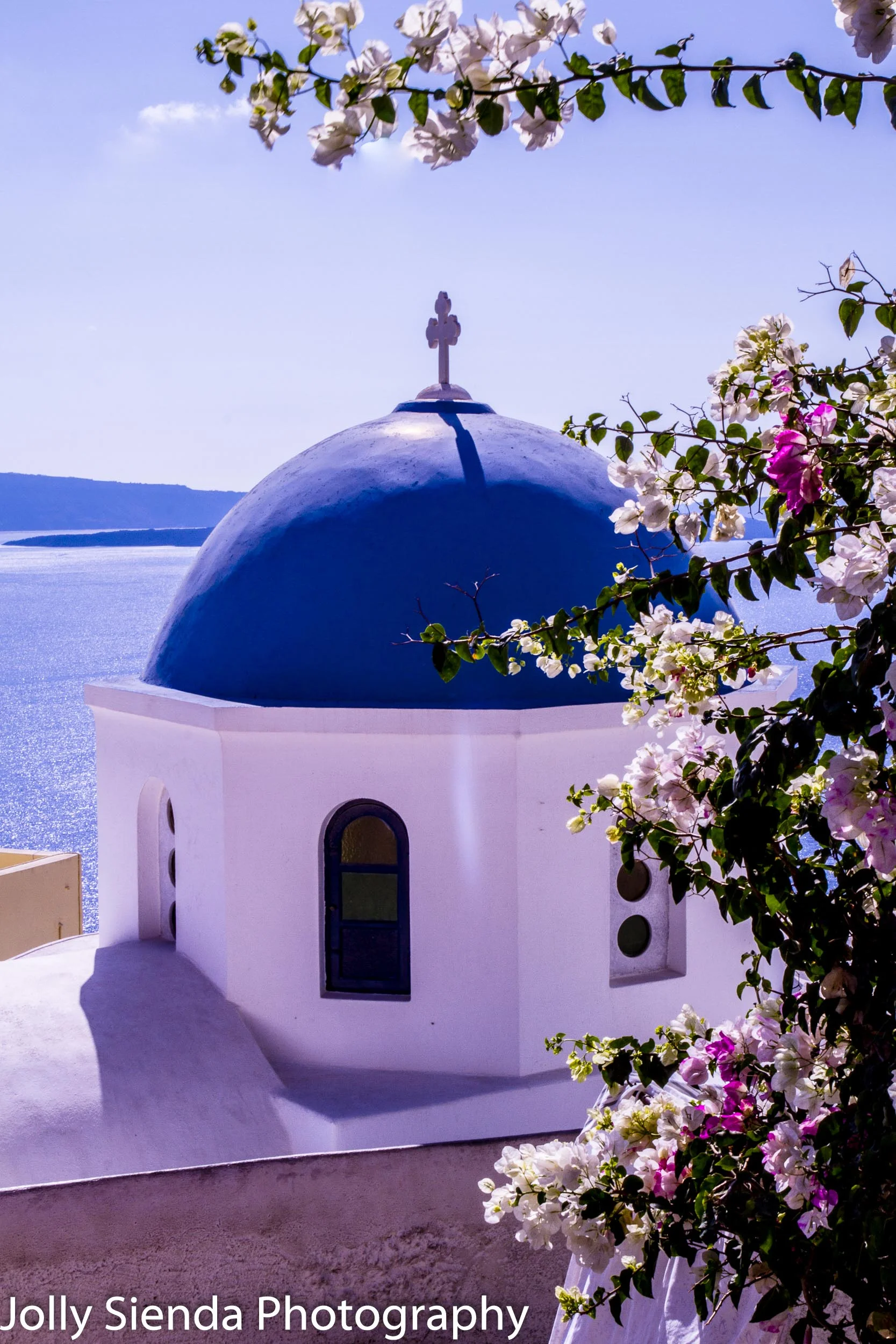 Greek Orthodox Church and bougainvillia, flowers over the Calder