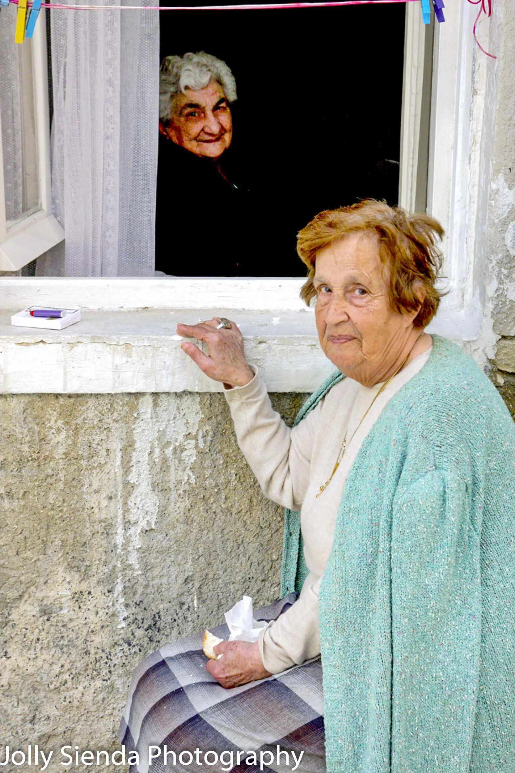Friends chat through the window
