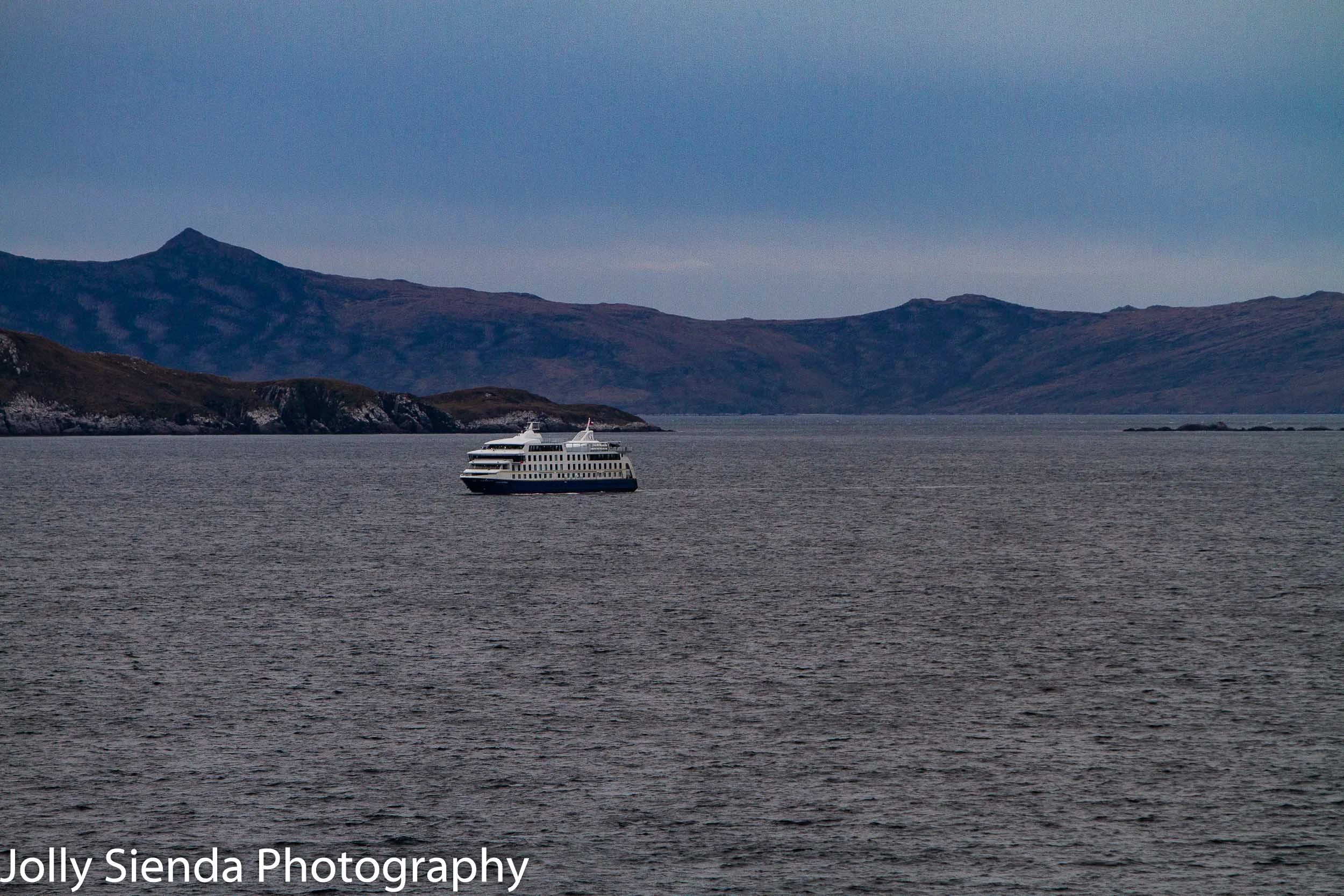 A cruise ship sails around the the Cape Horn, South America.