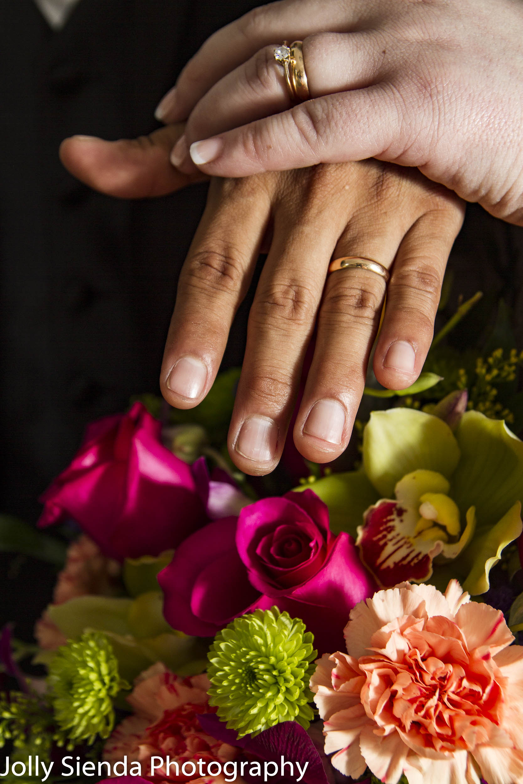 Portrait of the wedding rings and the bouquet