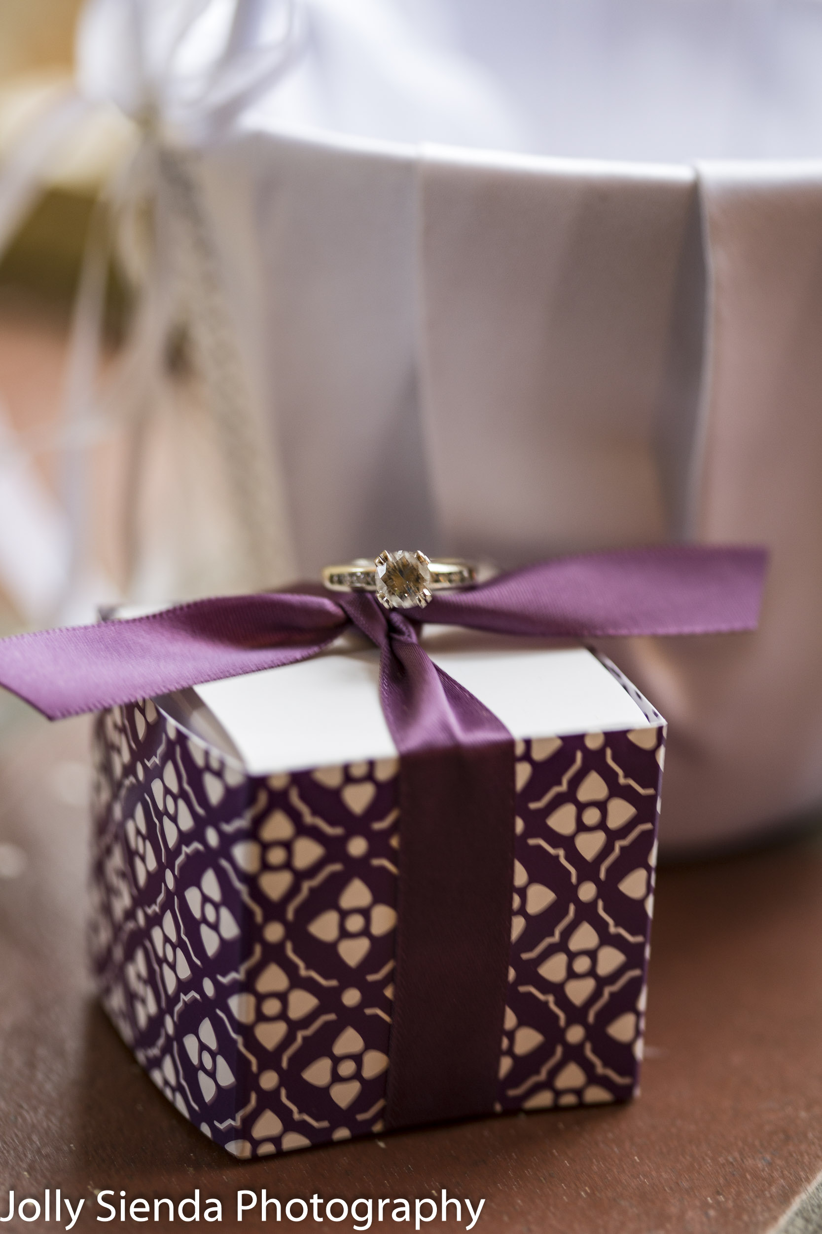 Diamond wedding ring on a wrapped package