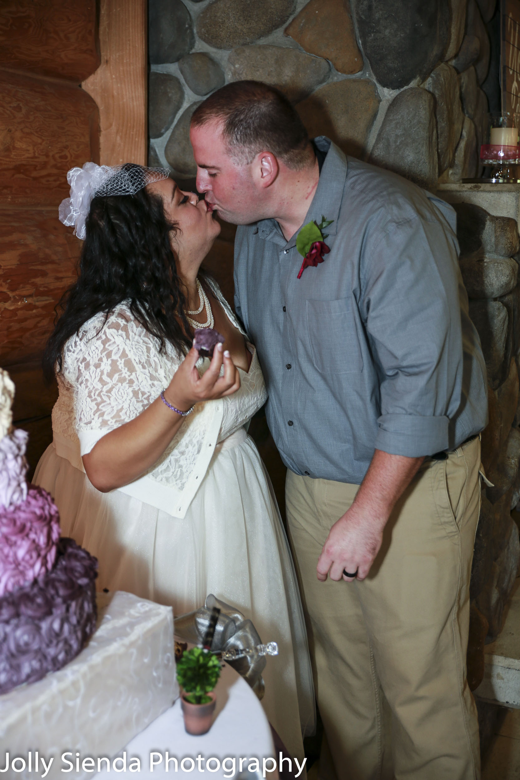 Nieves and Chad kiss while eating wedding cupcakes