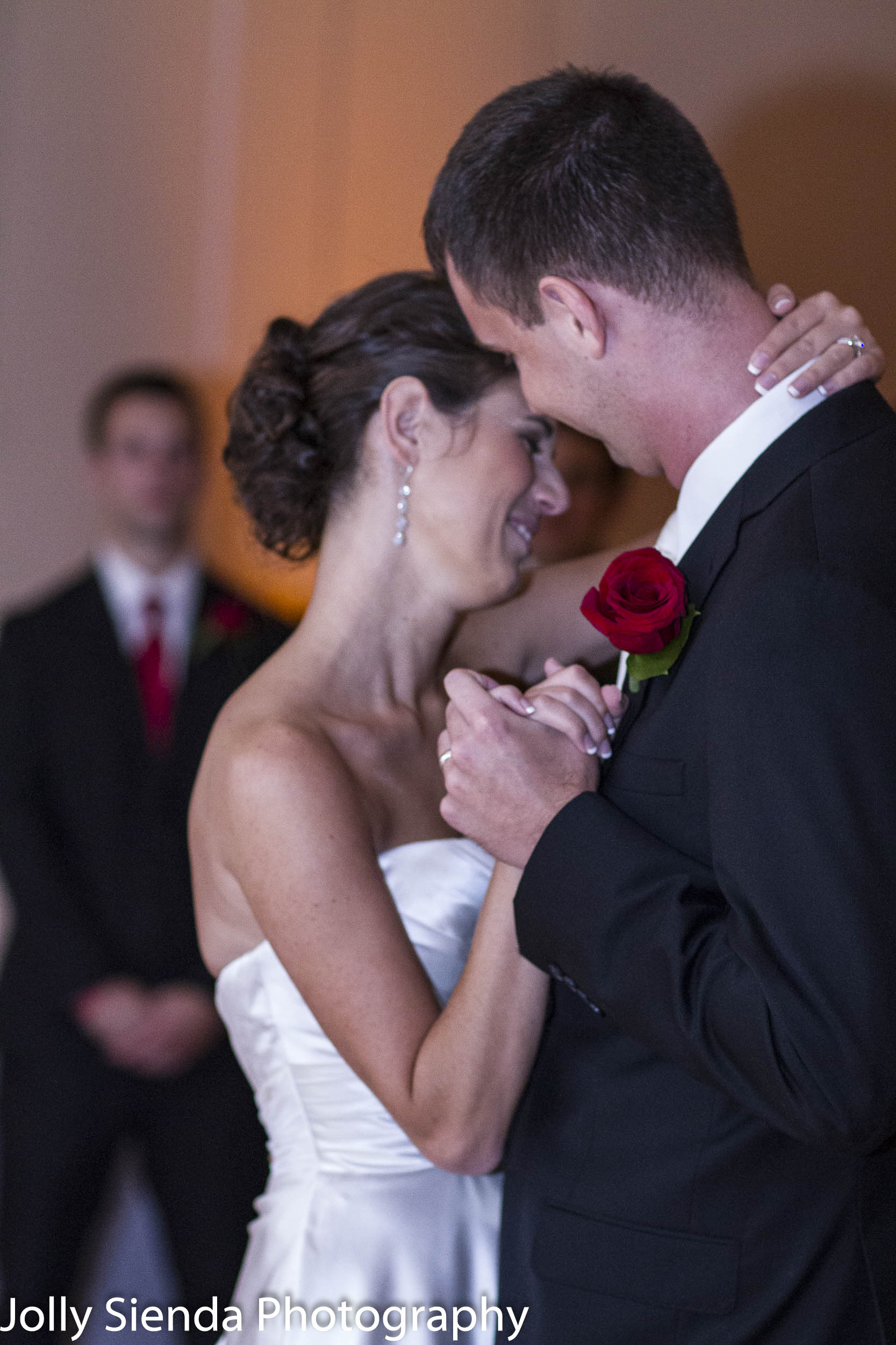 Bride blushes dancing with her husband