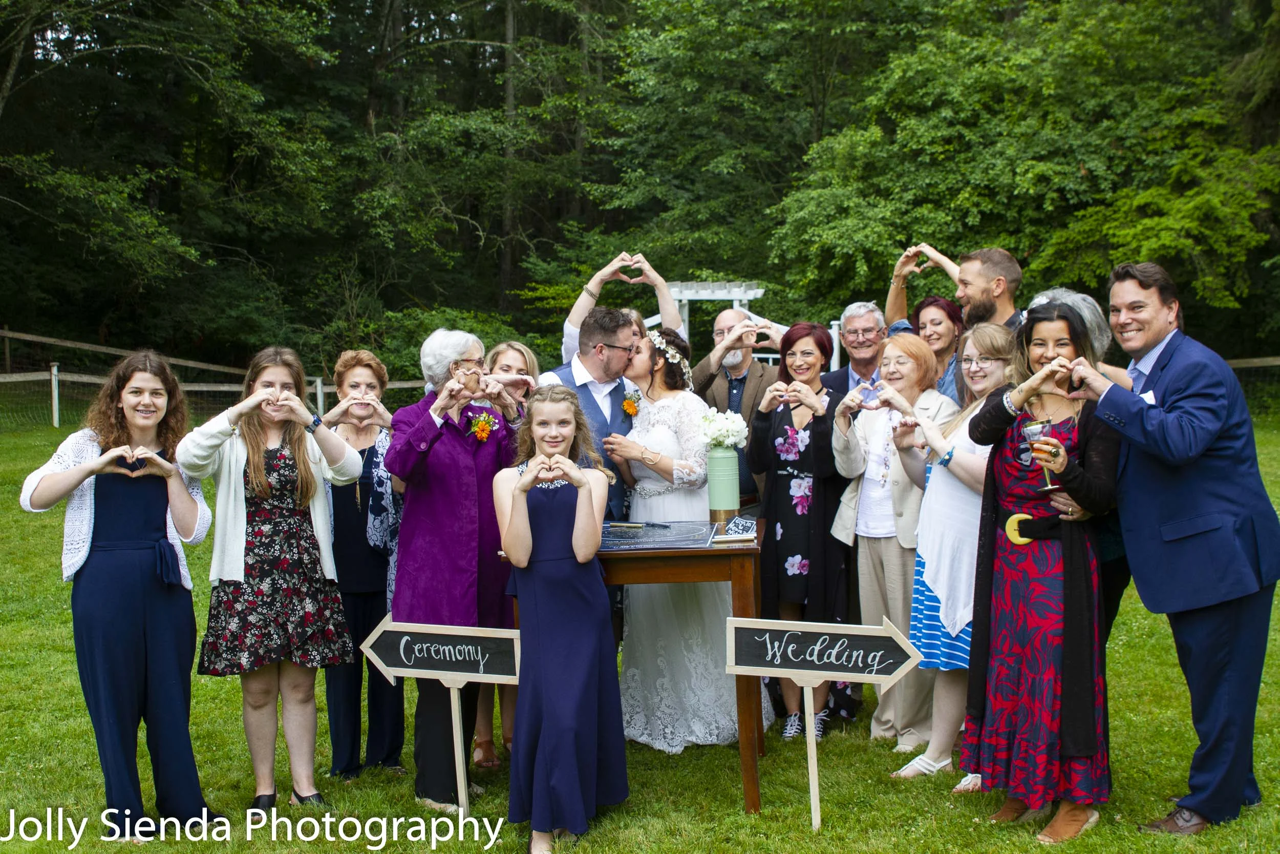 Guests form love hearts as Alicia and Jonathan share a kiss at their wedding!