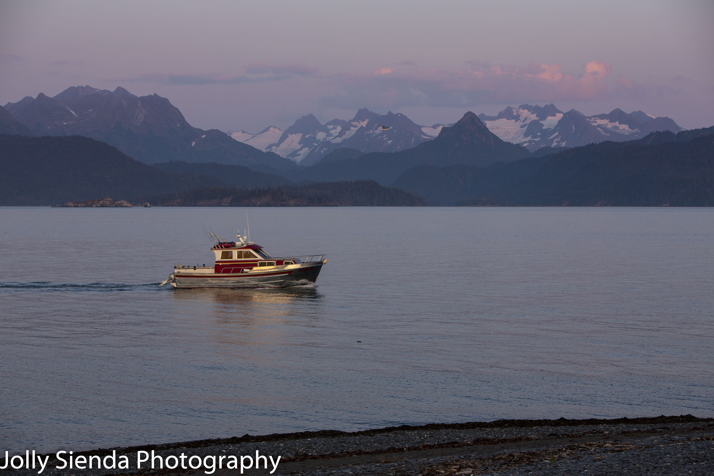 Boating on the  Kachemak Bay near glaciers and mountains