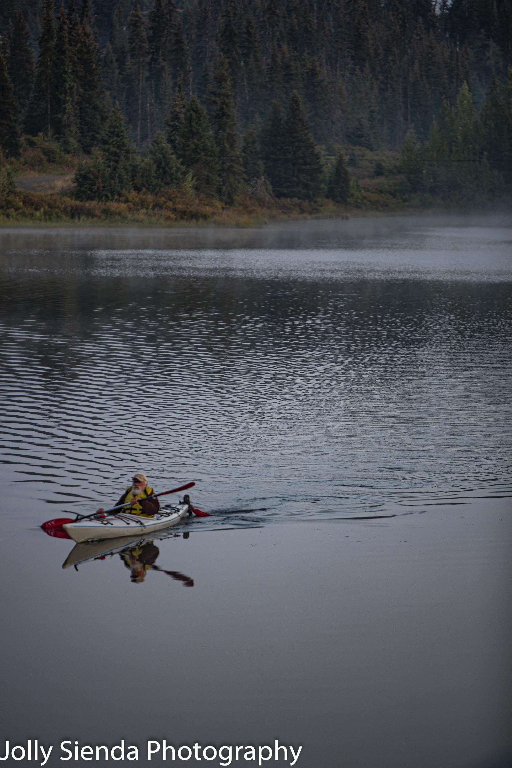 Kayaker on a lake in the Alaskan wilderness