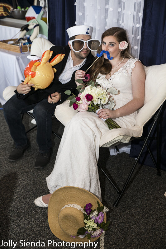 Oversized sunglasses and costume fun for the bride and groom at 