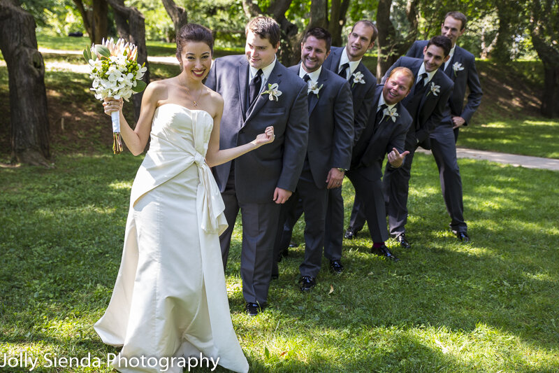 Wedding Photography  - The bride has the groomsmen attention