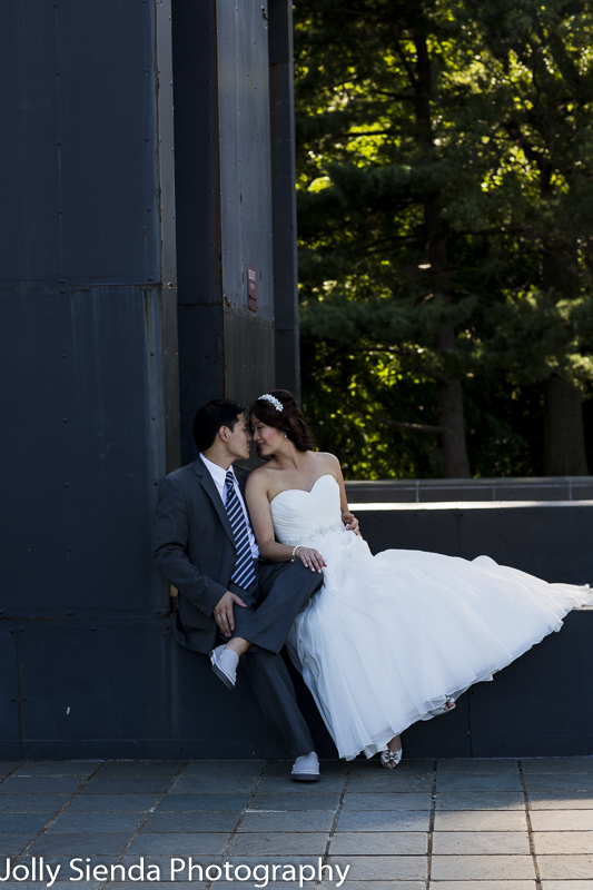 Urban city wedding photography, bride and groom on industrial le