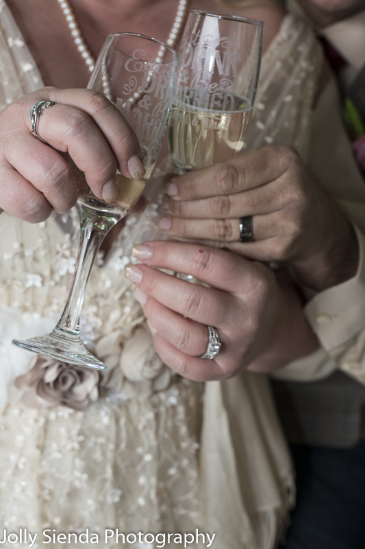 Champagne glasses, wedding rings wedding photography