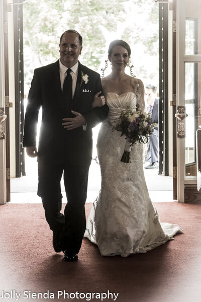 Wedding photographer - father walks the bride down the aisle