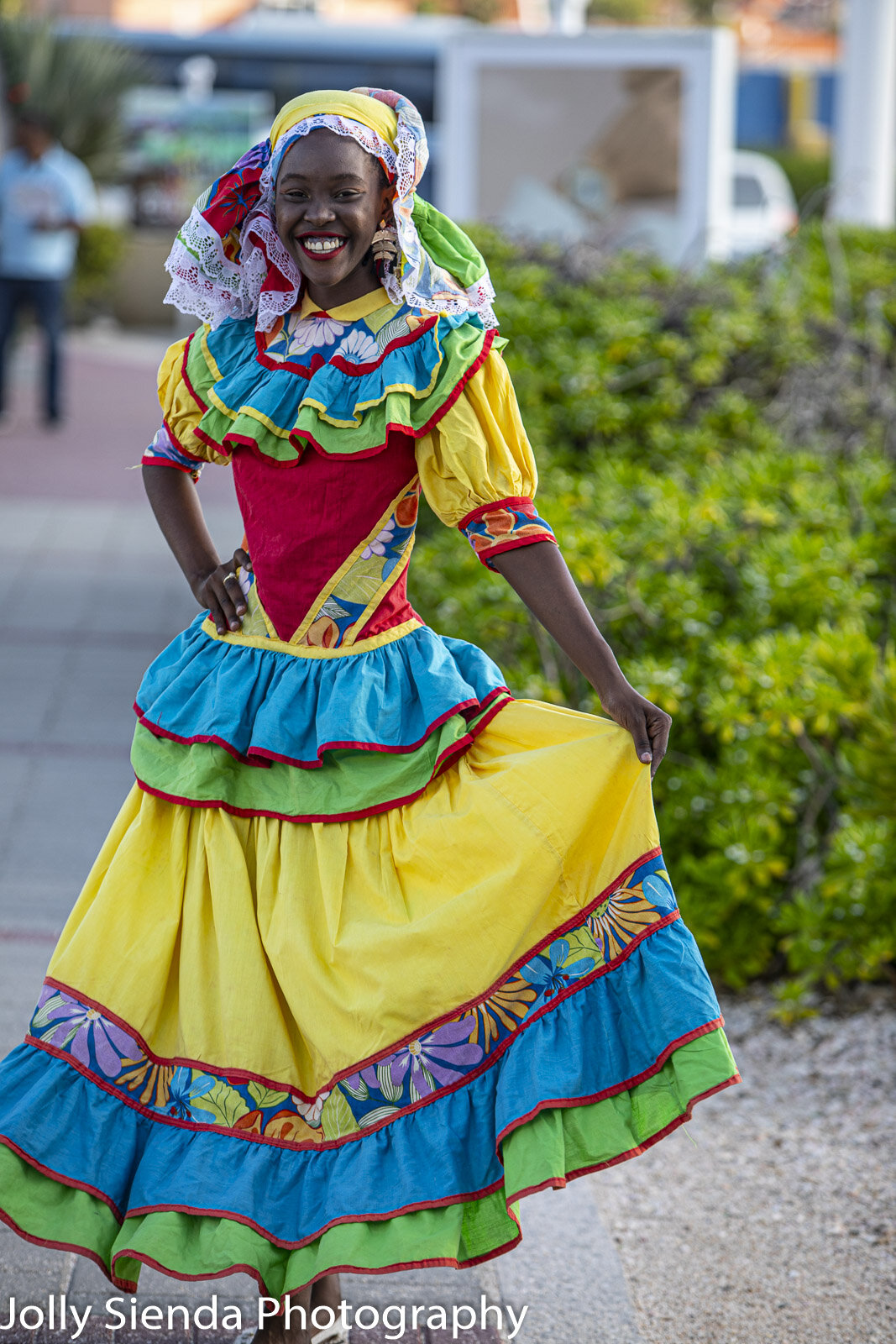 Girl wears coloful island native dress costume carnival