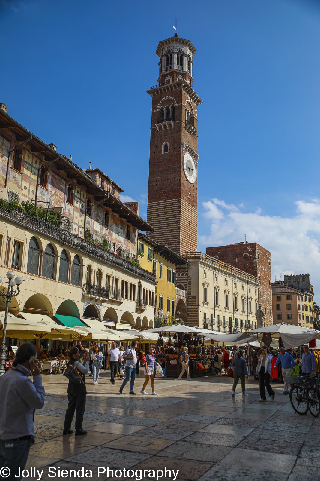 Verona market square with campanella tower and open air market