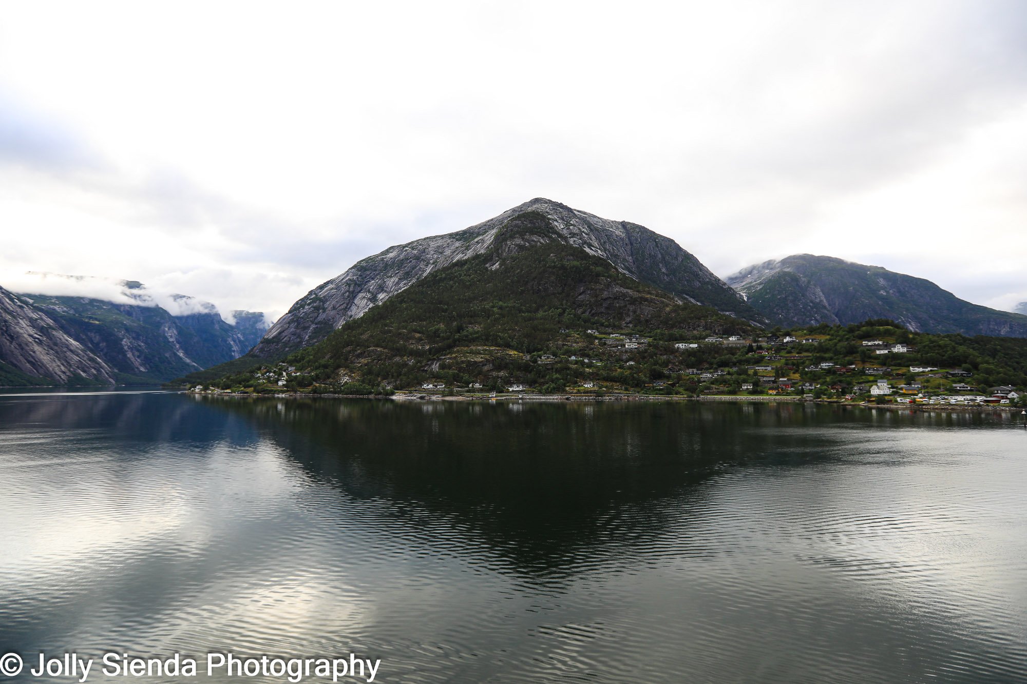 Dramatic Norwegian Fjords, water reflection and villages