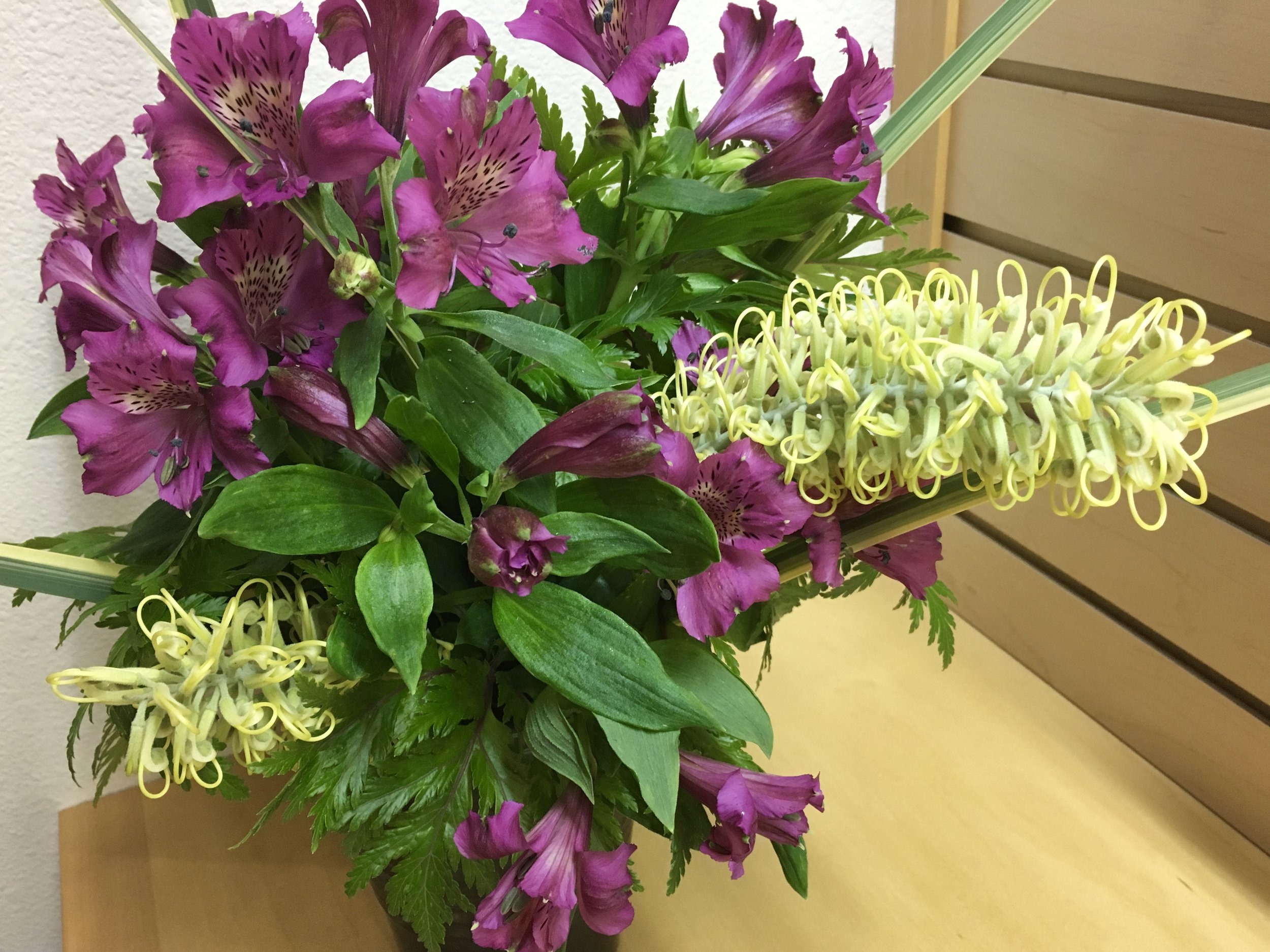 ‘Moonlight’ grevellia, alstroemeria, geranium leaves and dietes.
