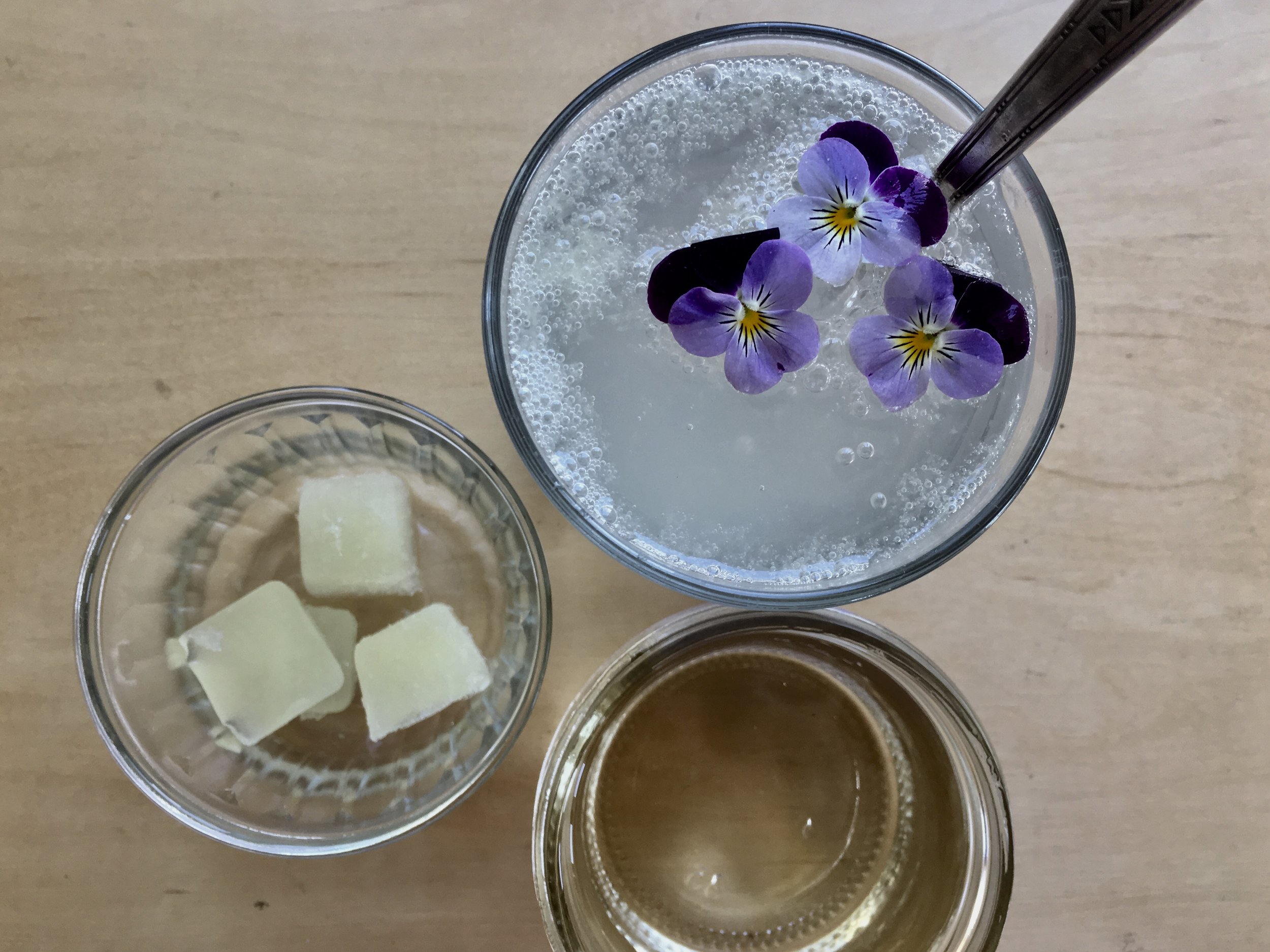 Lime soda with my frozen lime juice and violas.