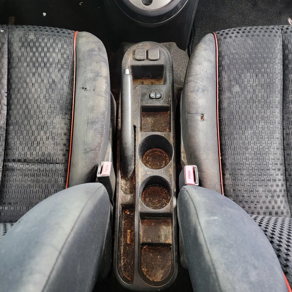 Heavily soiled vehicle interior before disaster detail