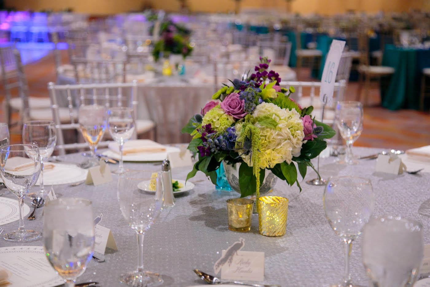 Floral arrangement with roses and hydrangea for masquerade gala by Yellow Canary Floral & Event Design
