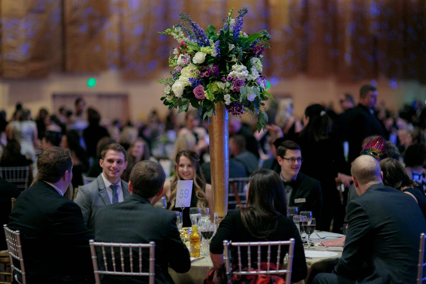 Floral arrangements by Yellow Canary Floral & Event Design with rose, hydrangea and dusty miller for Health Carousel Gala