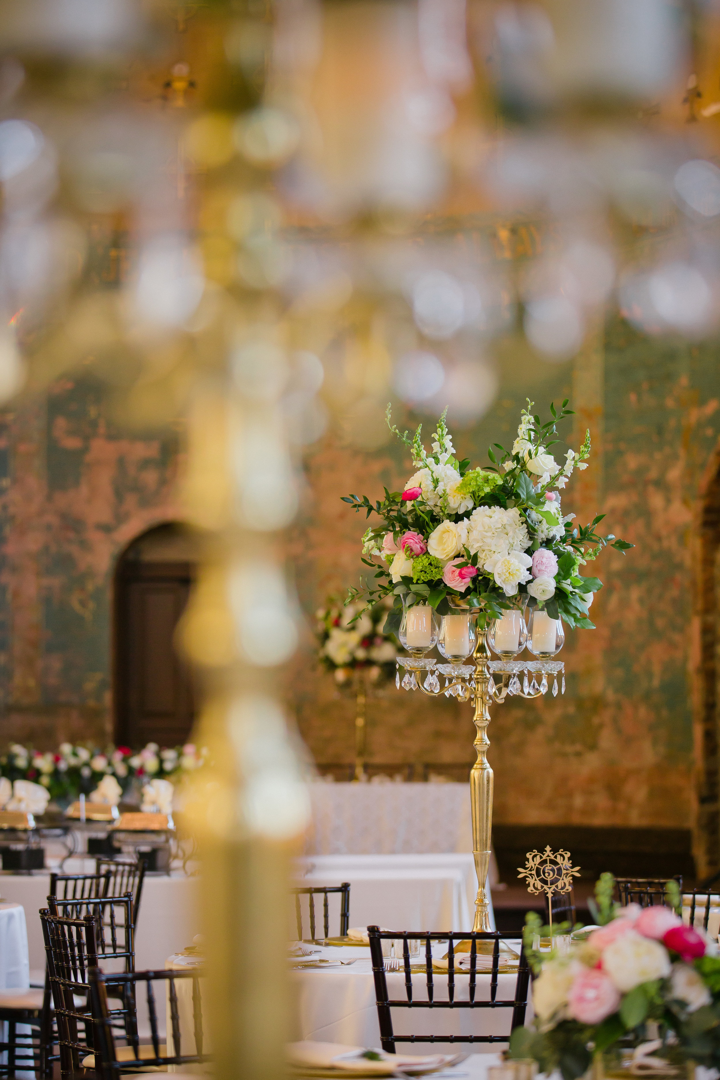 Focal arrangement with pink, white, and red roses for Monastery Event Center wedding in Cincinnati.  Florals by Yellow Canary www.yellowcanaryonline.com