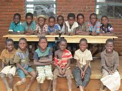 School desks being donated to the school; another 100 to go