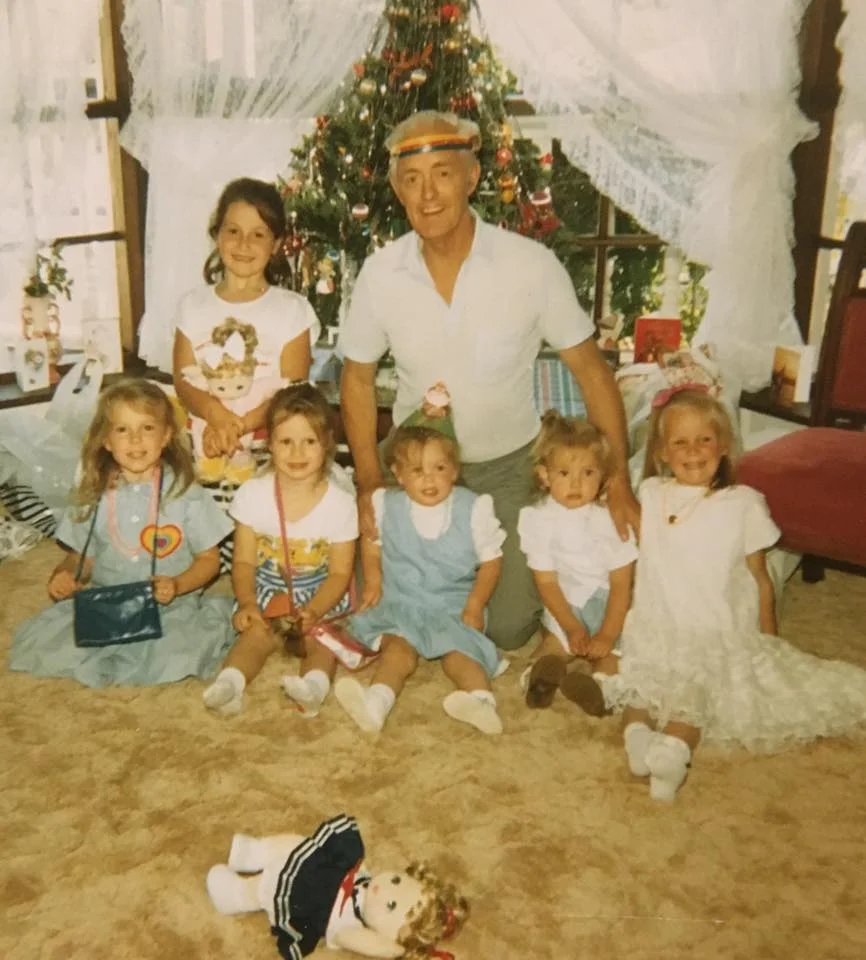 Christmas day in front of the bay window. Poppa wearing his rainbow headband. That’s me on the far right along with my sister and cousins