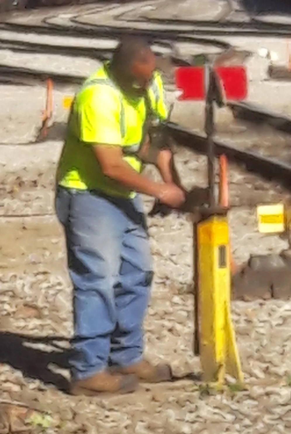 I snapped this picture of a man adjusting the track, thinking he’d be beneficial to the picture. I ended up taping this image to my paintbox and copying it in the various incarnations of the painting. For the record, he is called a Switchman. His jo…