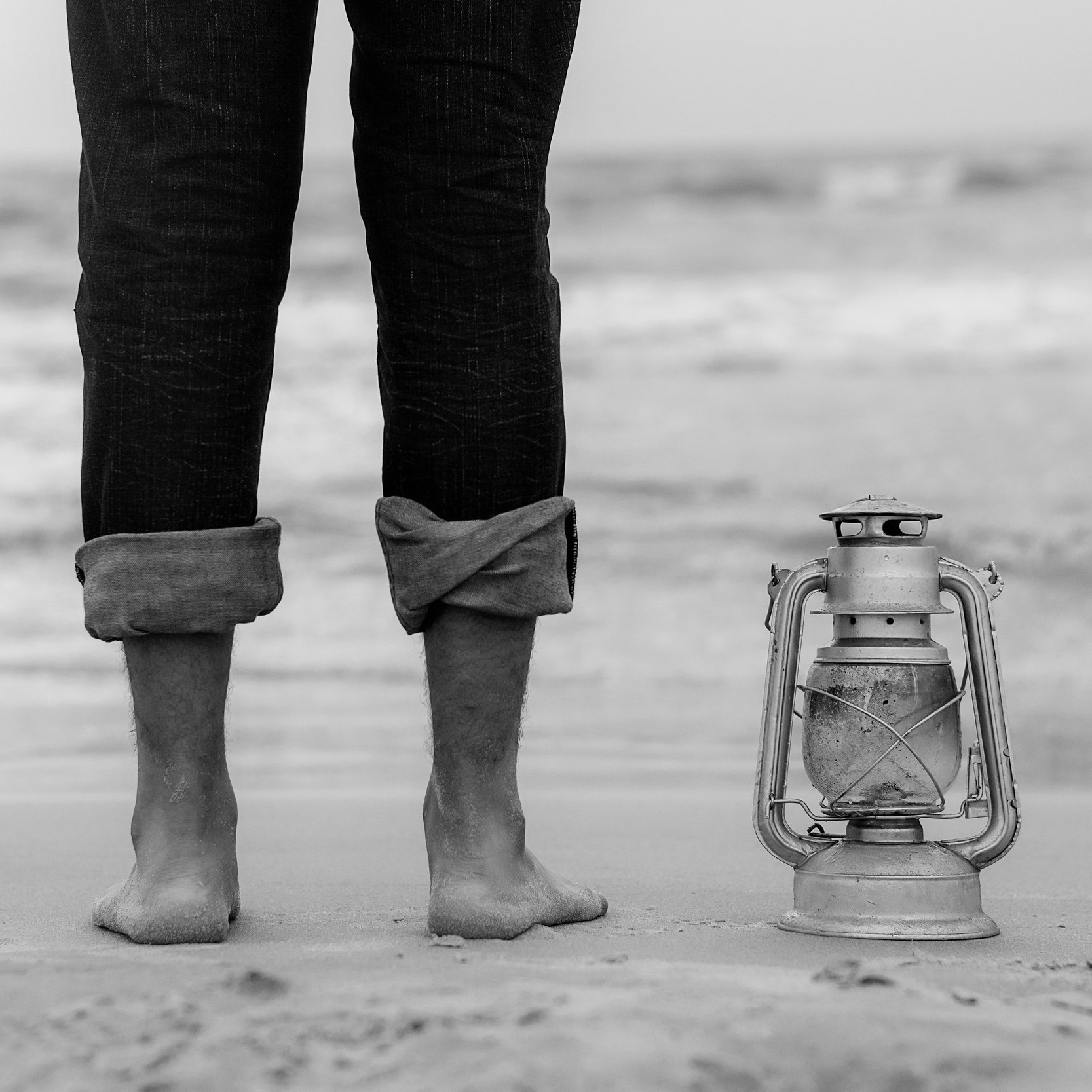 Canva+-+Person+Standing+on+Shoreline+Beside+Gray+Tubular+Lantern+%281%29.jpg