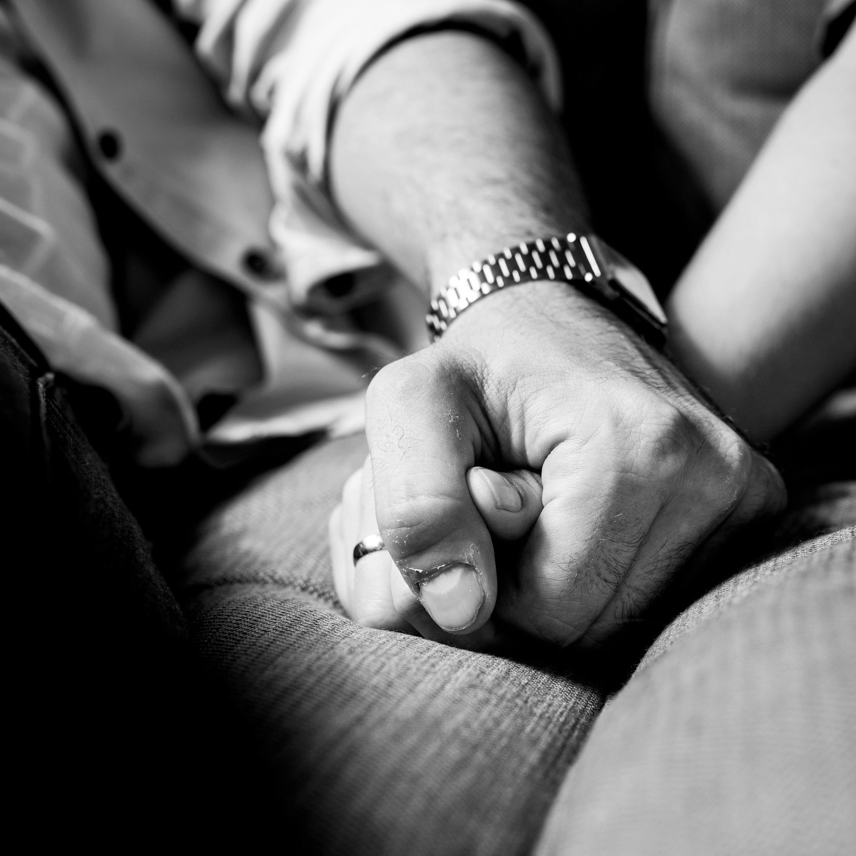 Canva+-+Two+Person+Holding+Hands+While+Sitting+on+Grey+Cushion.jpg
