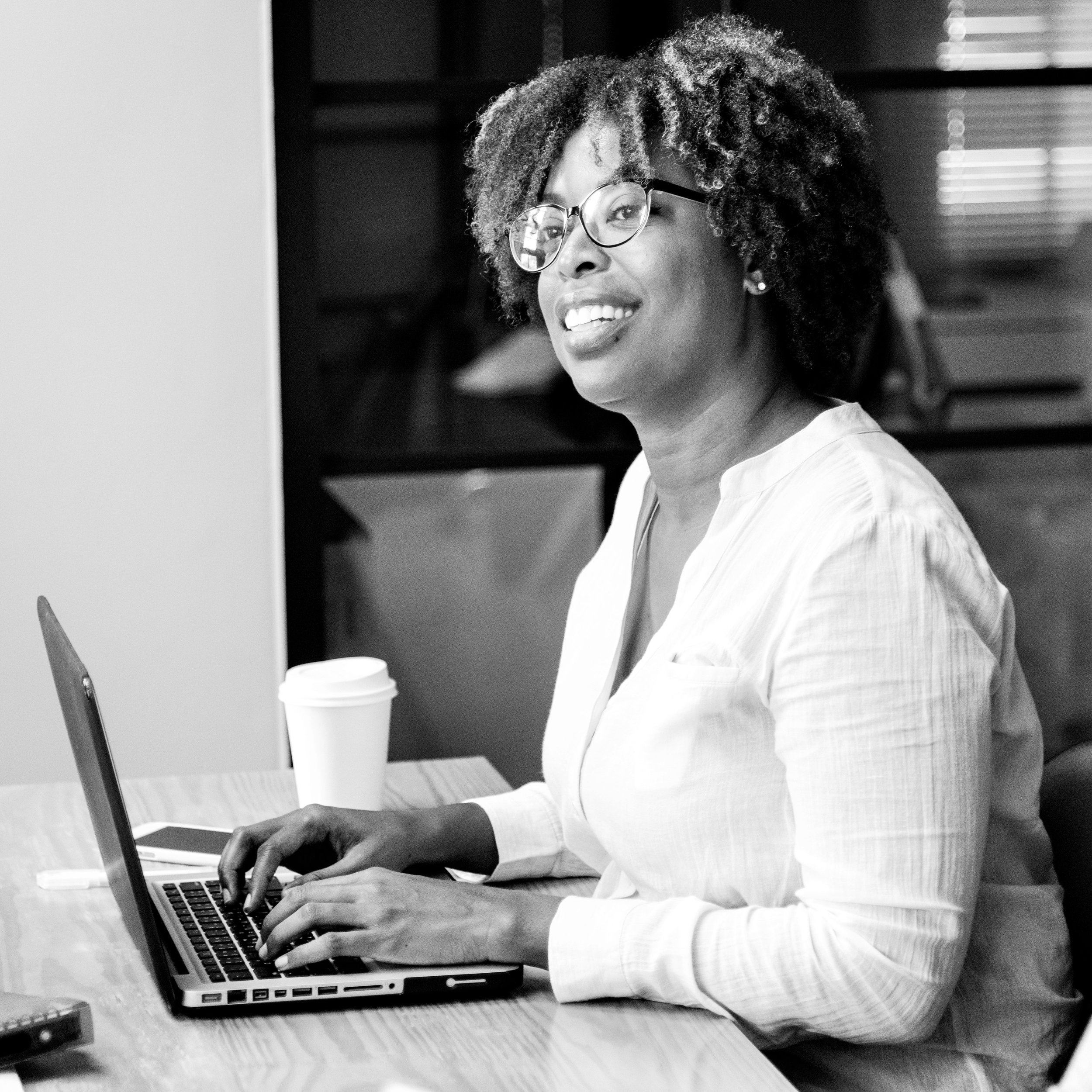 Canva+-+Woman+in+White+Long-sleeved+Top+Using+Laptop+Computer.jpg