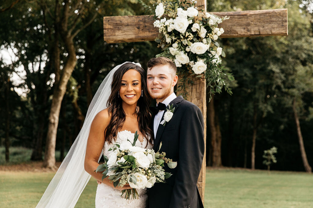 mixed-christian-wedding-couple-white-flowers