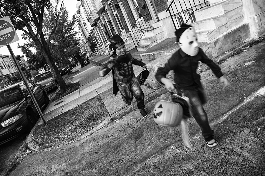 A seven year old trick-or-treating in Baltimore's Highlandtown